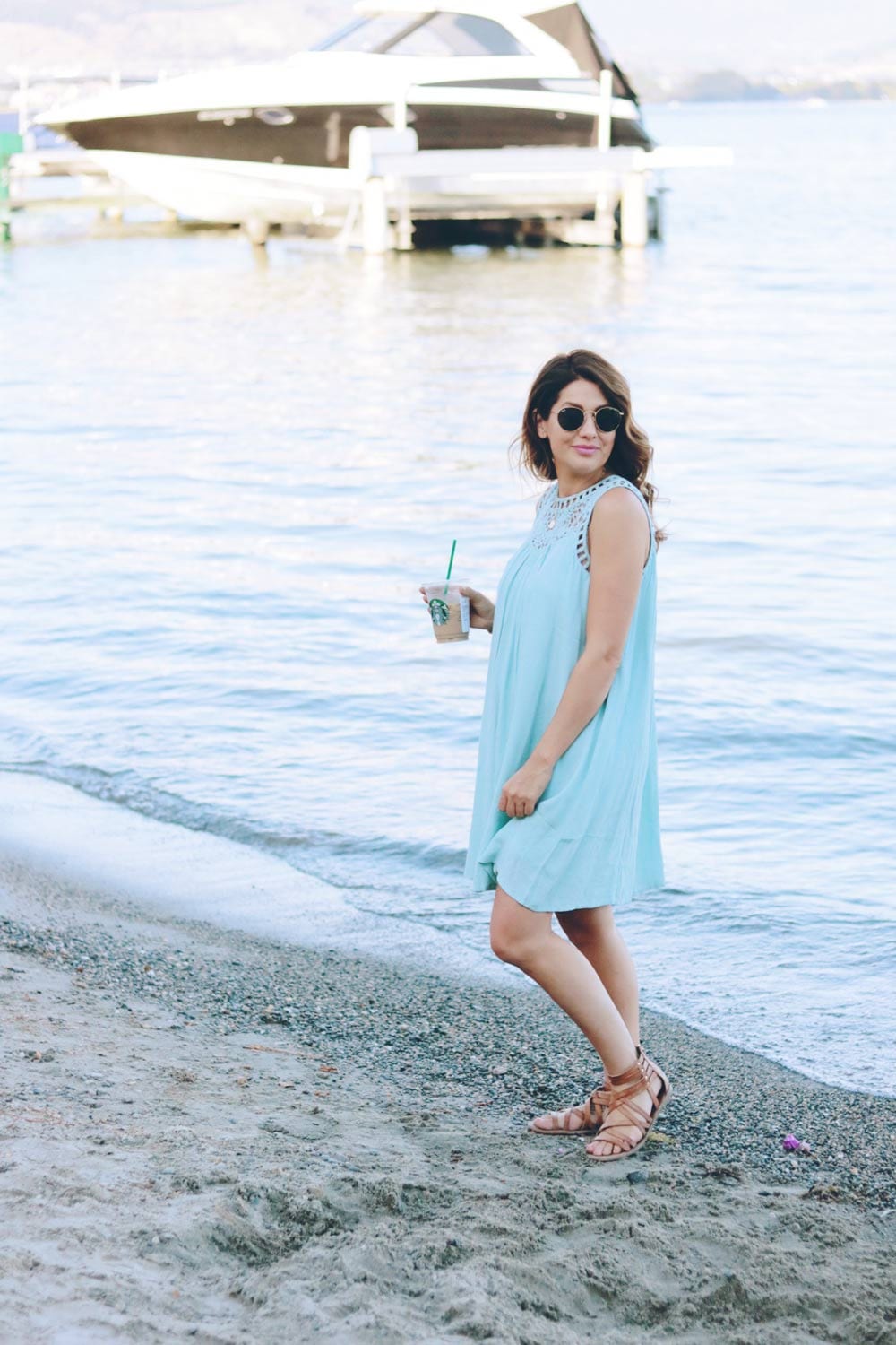 jill-standing-with-starbucks-on-beach