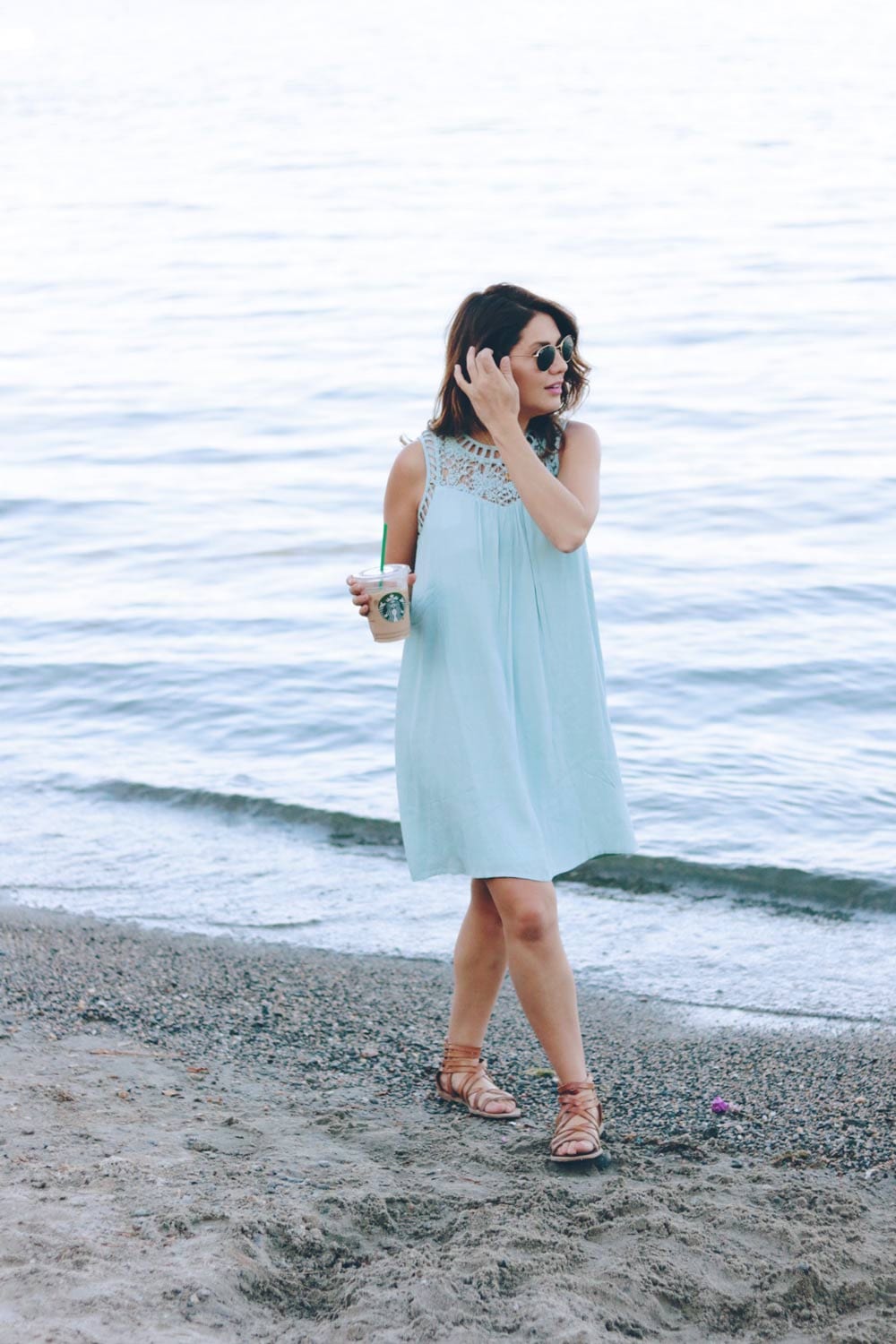 jill-walking-on-the-beach-with-starbucks-