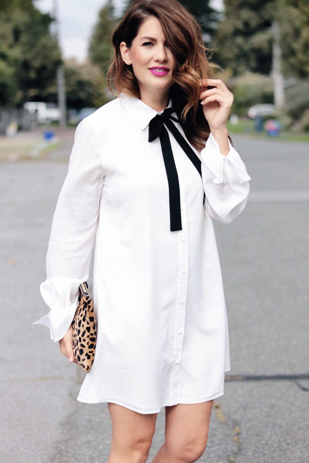 jillian harris wearing button up dress with bow tie