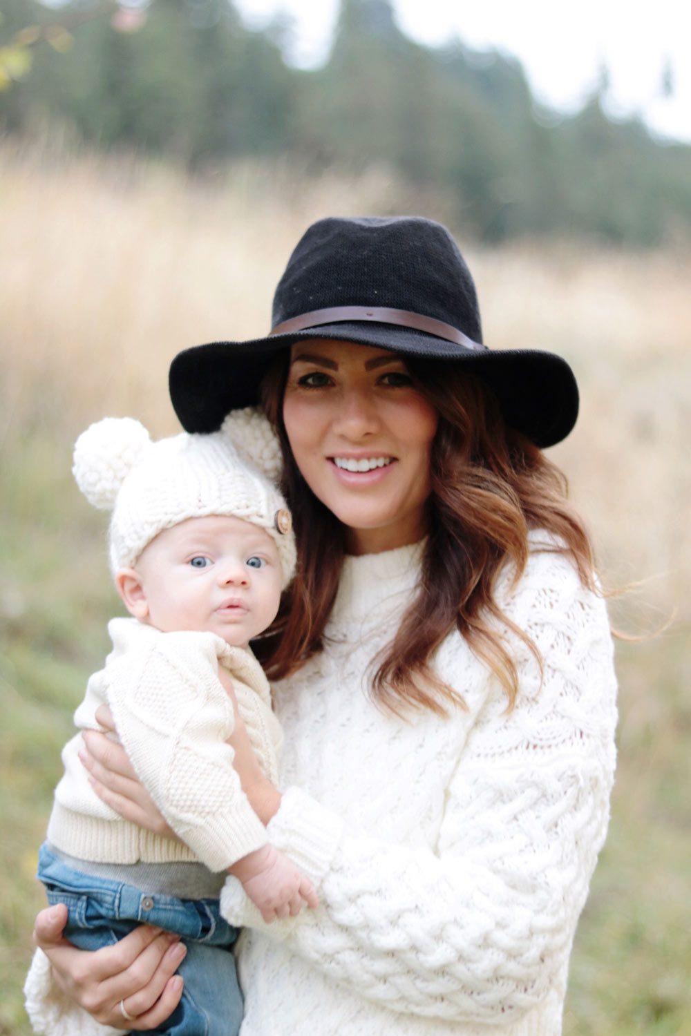 jill-holding-leo-in-the-orchard-in-goodnight-macaroon-sweater-and-hat