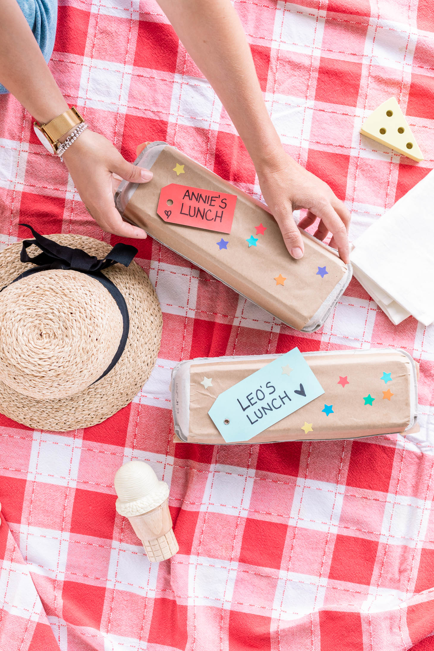 Jillian Harris picking up an egg carton that says "Annie's lunch" 