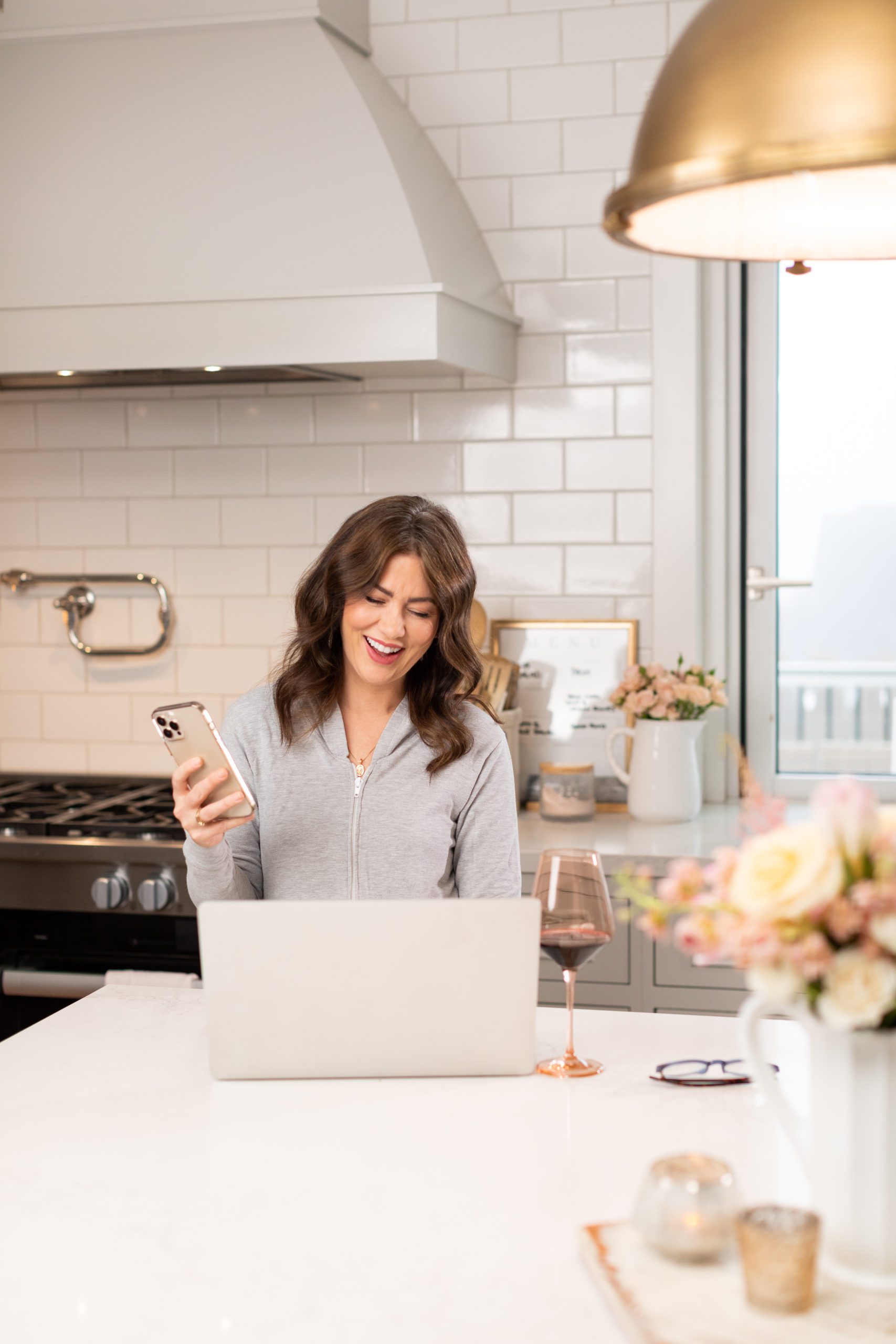 Jillian Harris on Laptop for the Jilly Academy