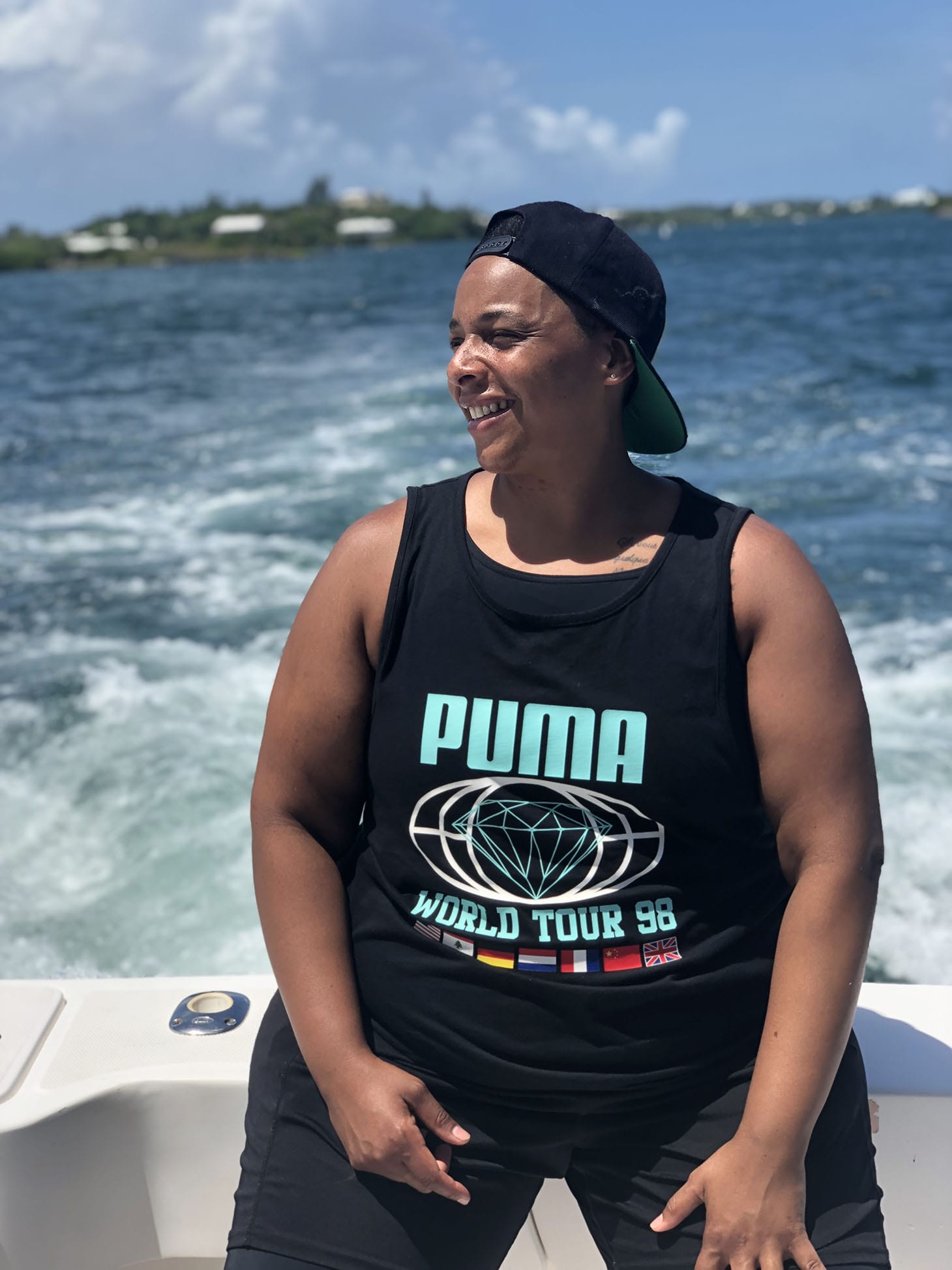 Health and Wellness coach, Coach Carey on a boat on a sunny day. 