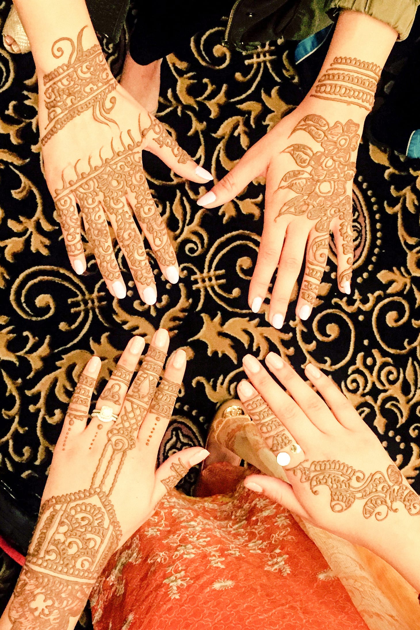 Henna Tattoo on a 2 womens hands.