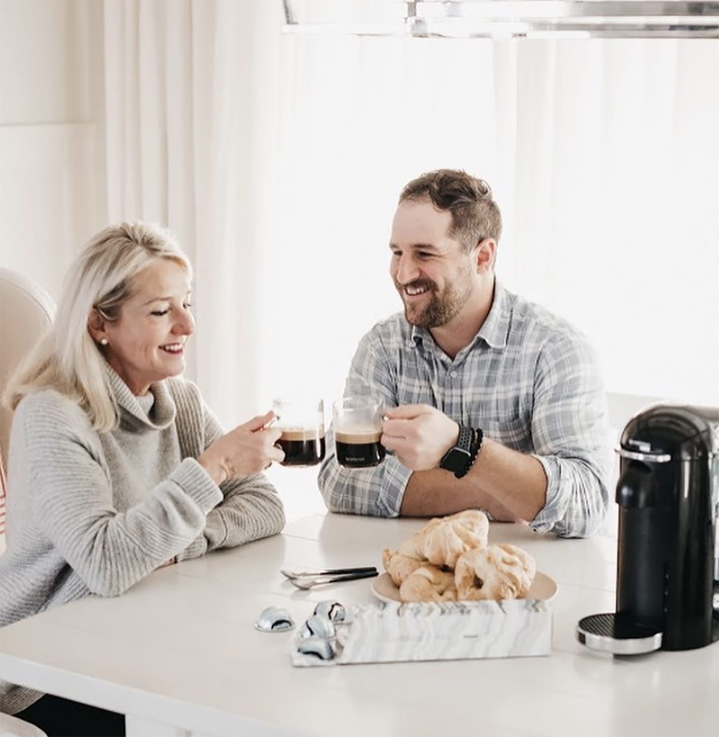 Justin Pasutto and his mom with coffees discussing the importance of conscious parenting over discipline.