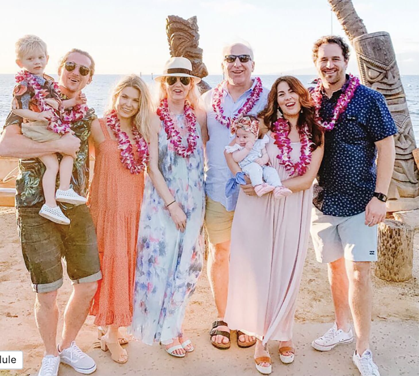 Jillian Harris and Justin Pasutto with extended family on a beach in Hawaii. 