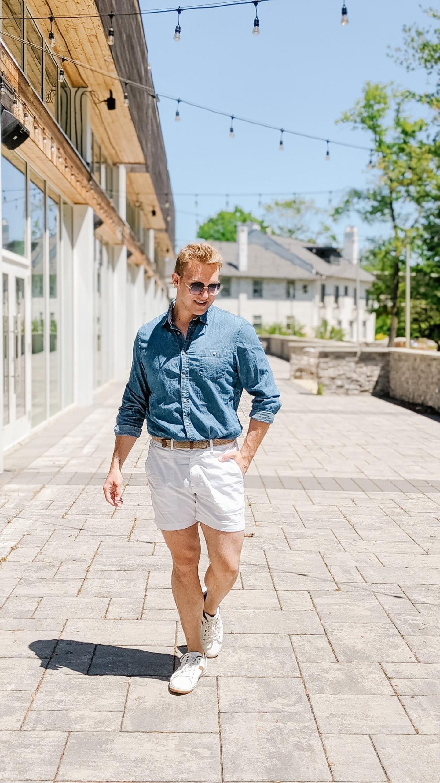 Christopher Allen's outside a white building wearing one of his Favourite Summer Fits.