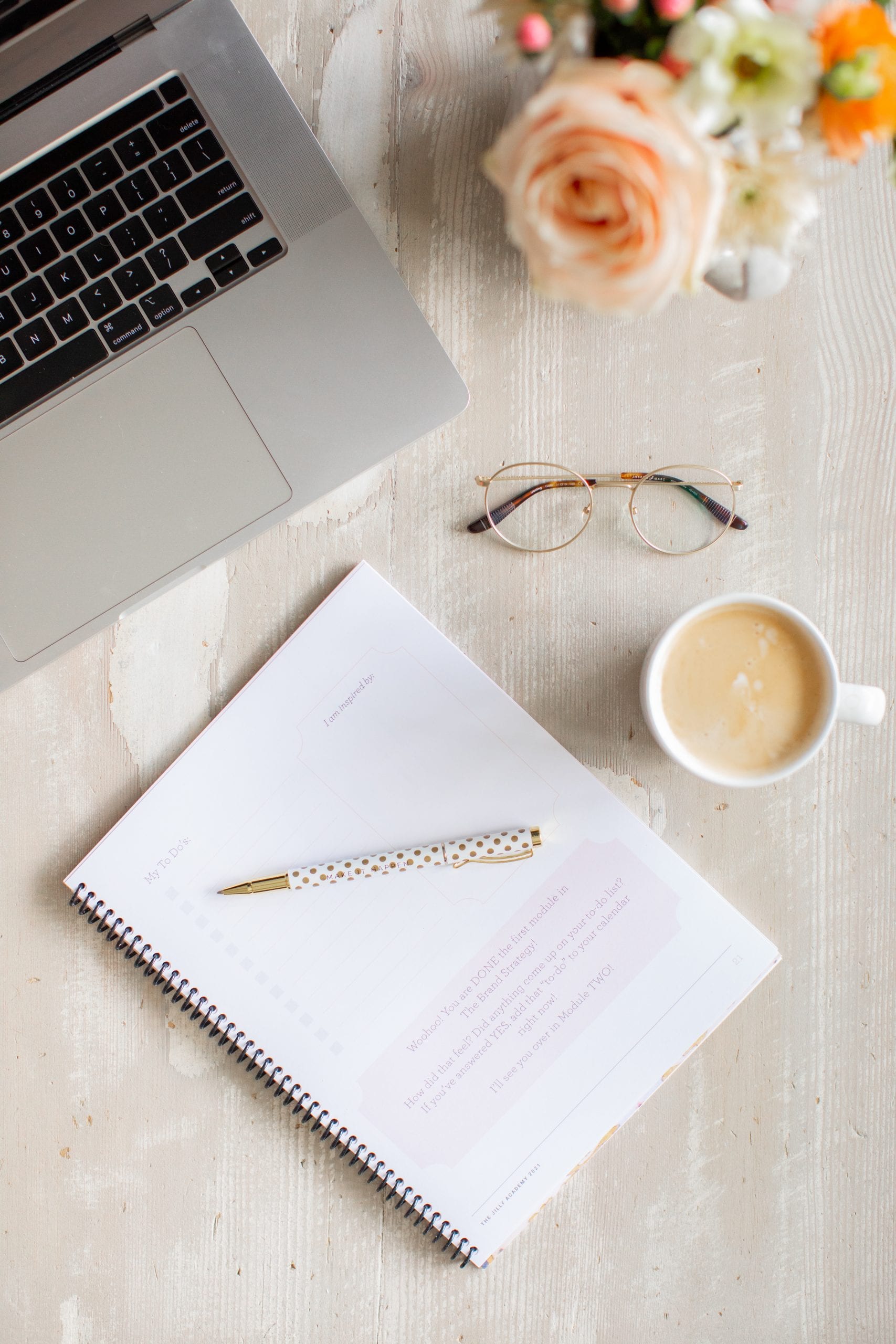 Jillian Harris is now offering Stock Photo Imagery through The Jilly Academy Campus Store such as this flat lay image of the Course workbook, laptop, coffee, pen, and glasses.