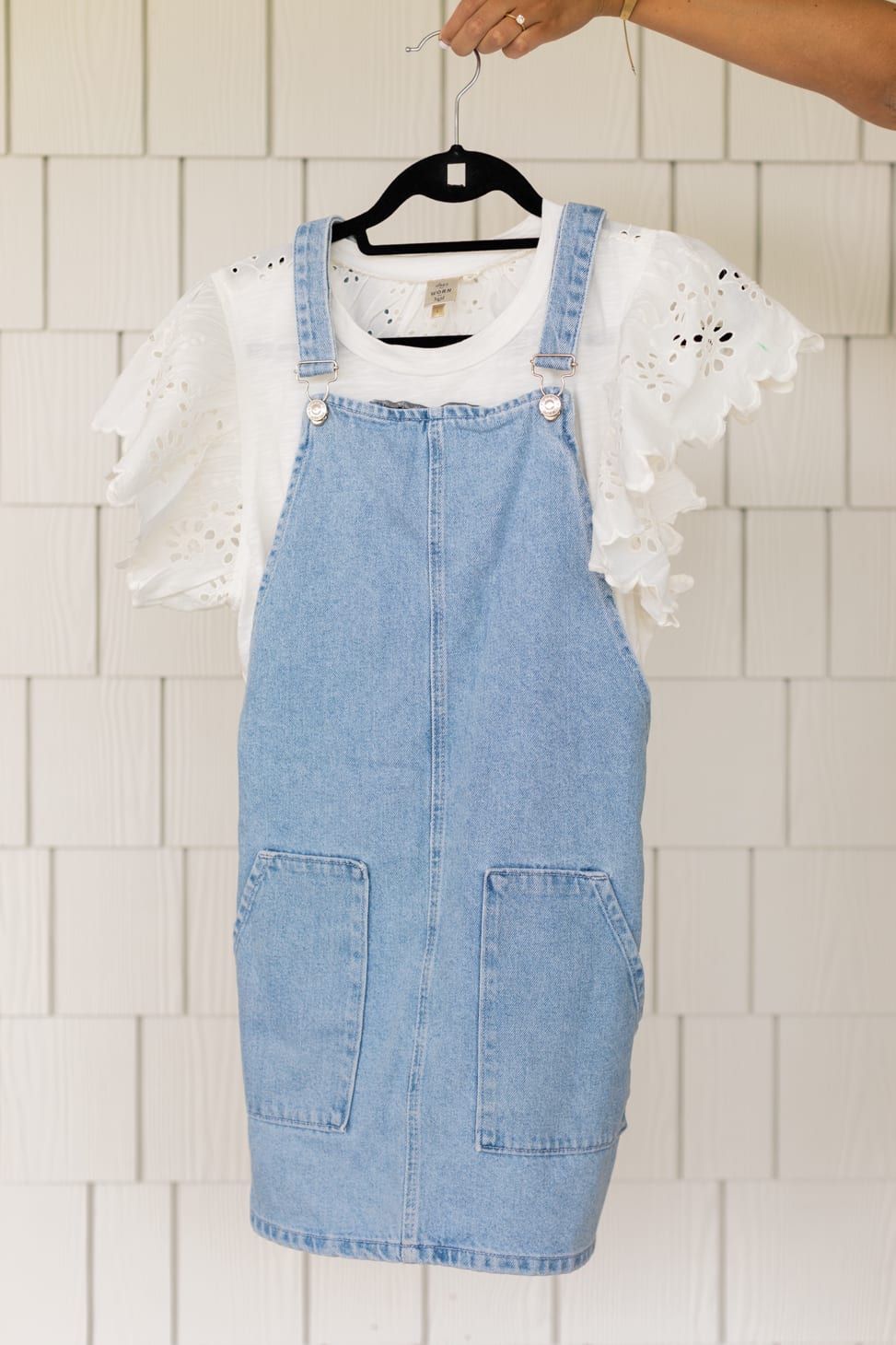 Knee length Overall Dress with a white t-shirt with floral pattern cut out on ruffled sleeves.