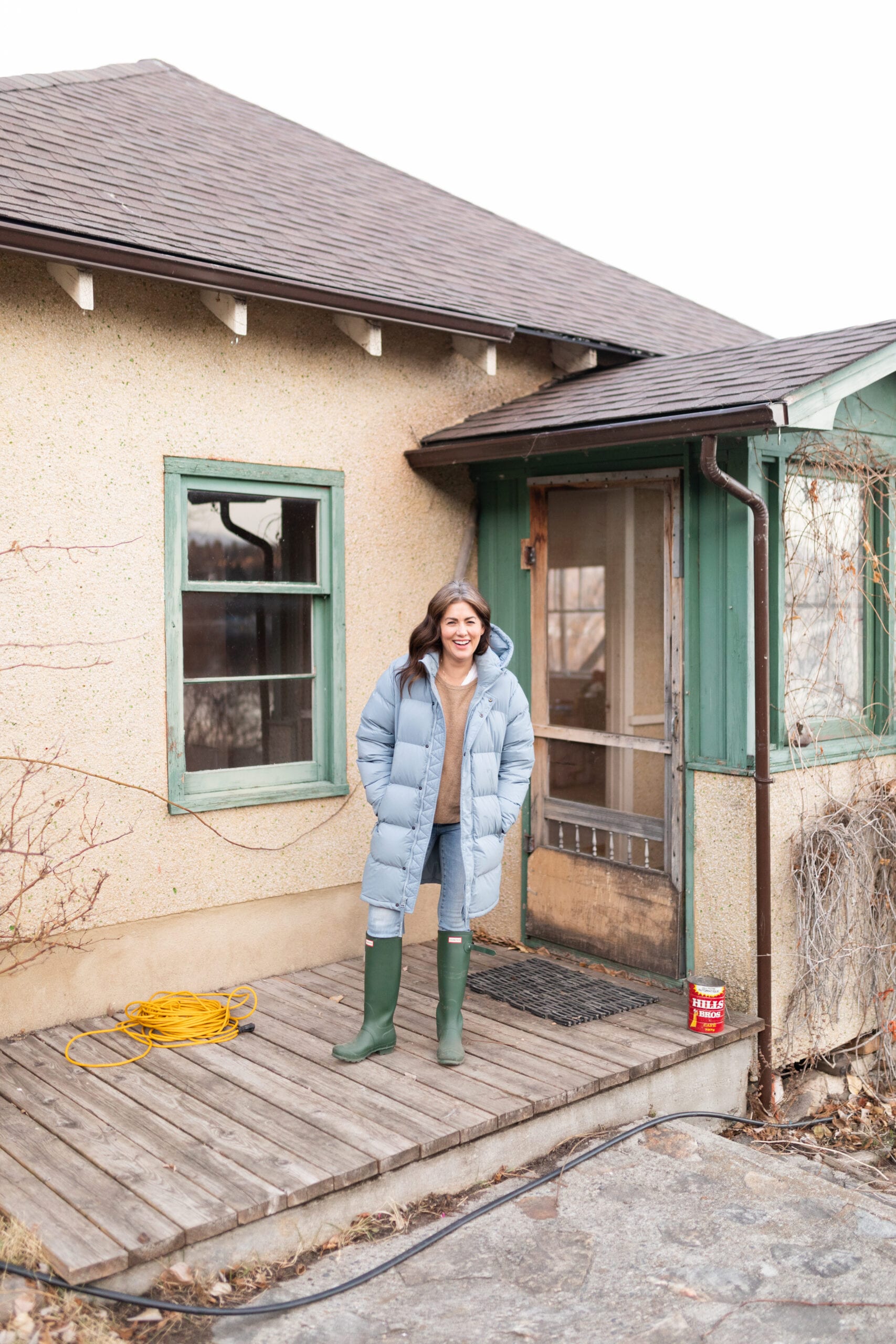 Jillian Harris on the front porch of her farmhouse before the refresh.