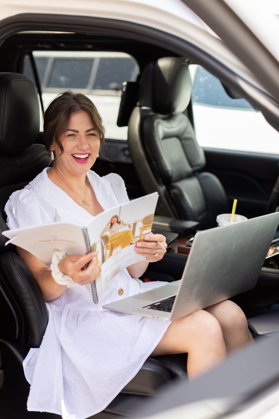 Jillian Harris checking in on The Jilly Academy Alumni during the summer, on-the-go in her car wearing a white dress. 