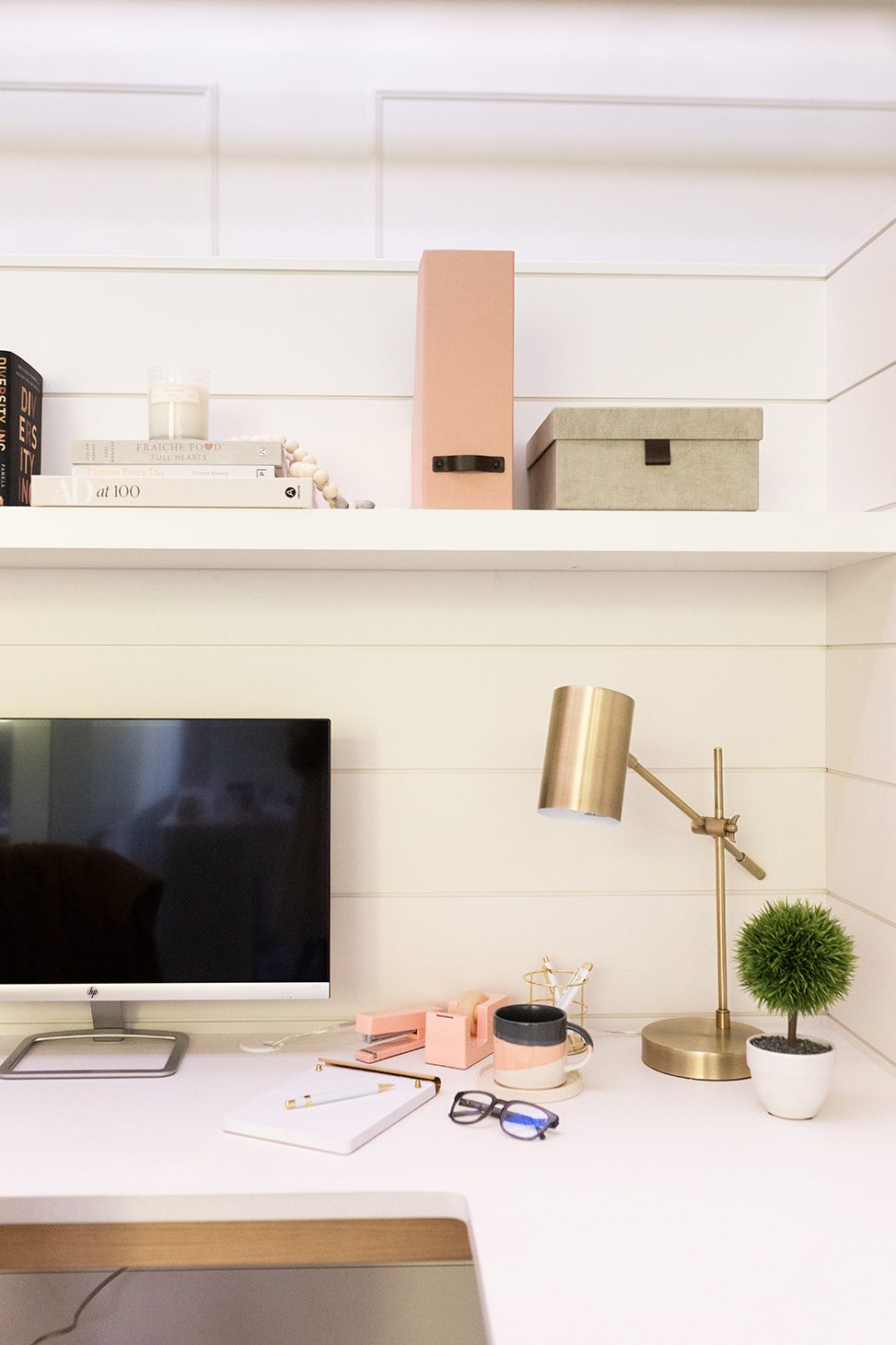 Jillian Harris' office setup with supplies, books, lamp, and computer. This photo is part of The Campus Store stock photo collections the Alumni love.