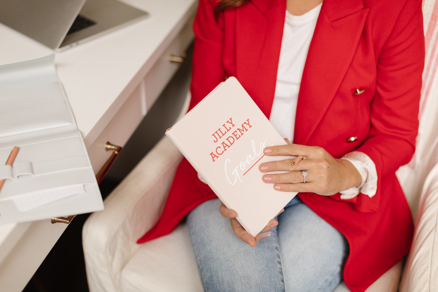 Jillian Harris holds The Jilly Academy Goals Planner that's featured in The Jilly Academy Box. 