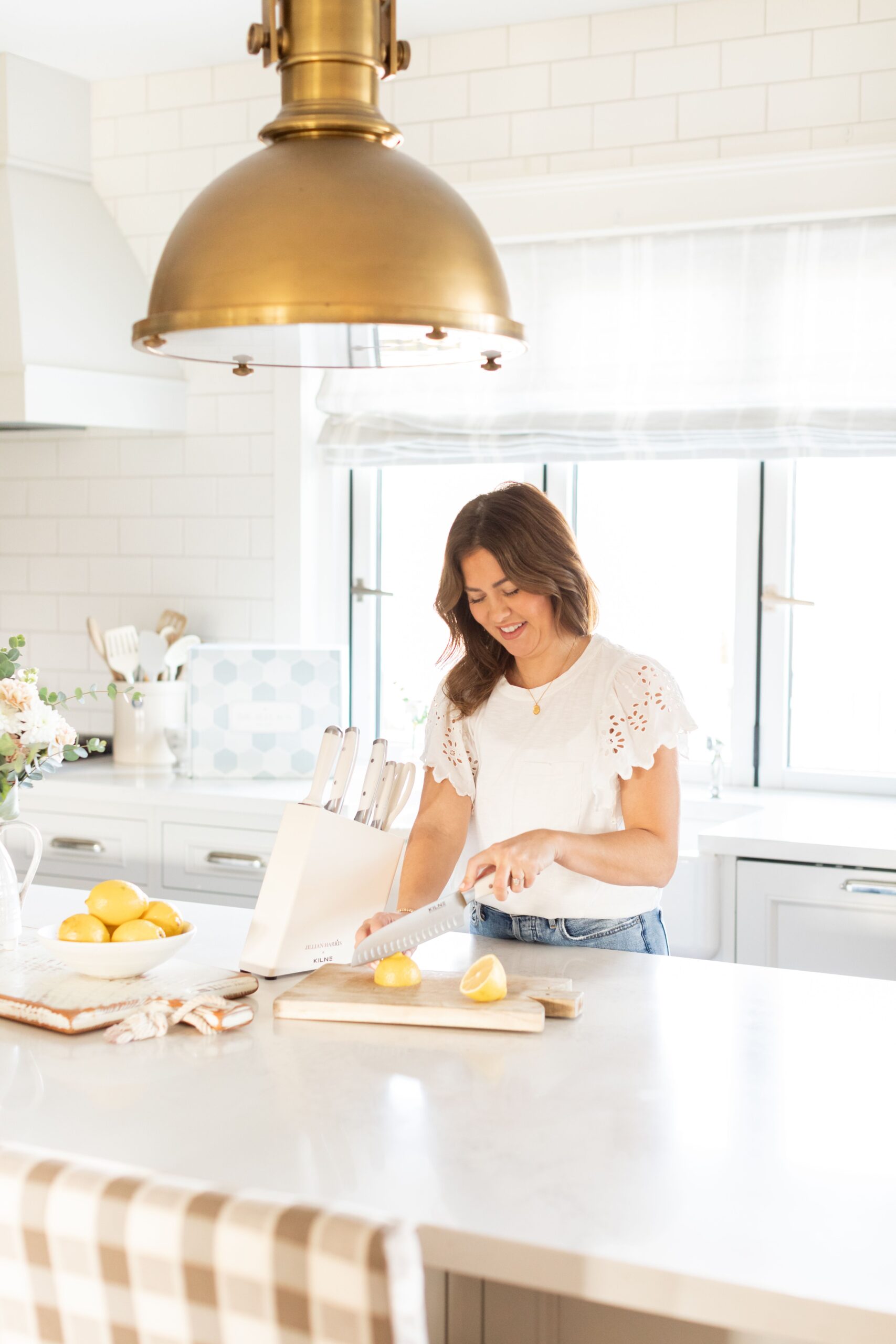 Jillian in her kitchen using the Kilne Knife Set included as a Add-On in the Spring 2022 Jilly Box