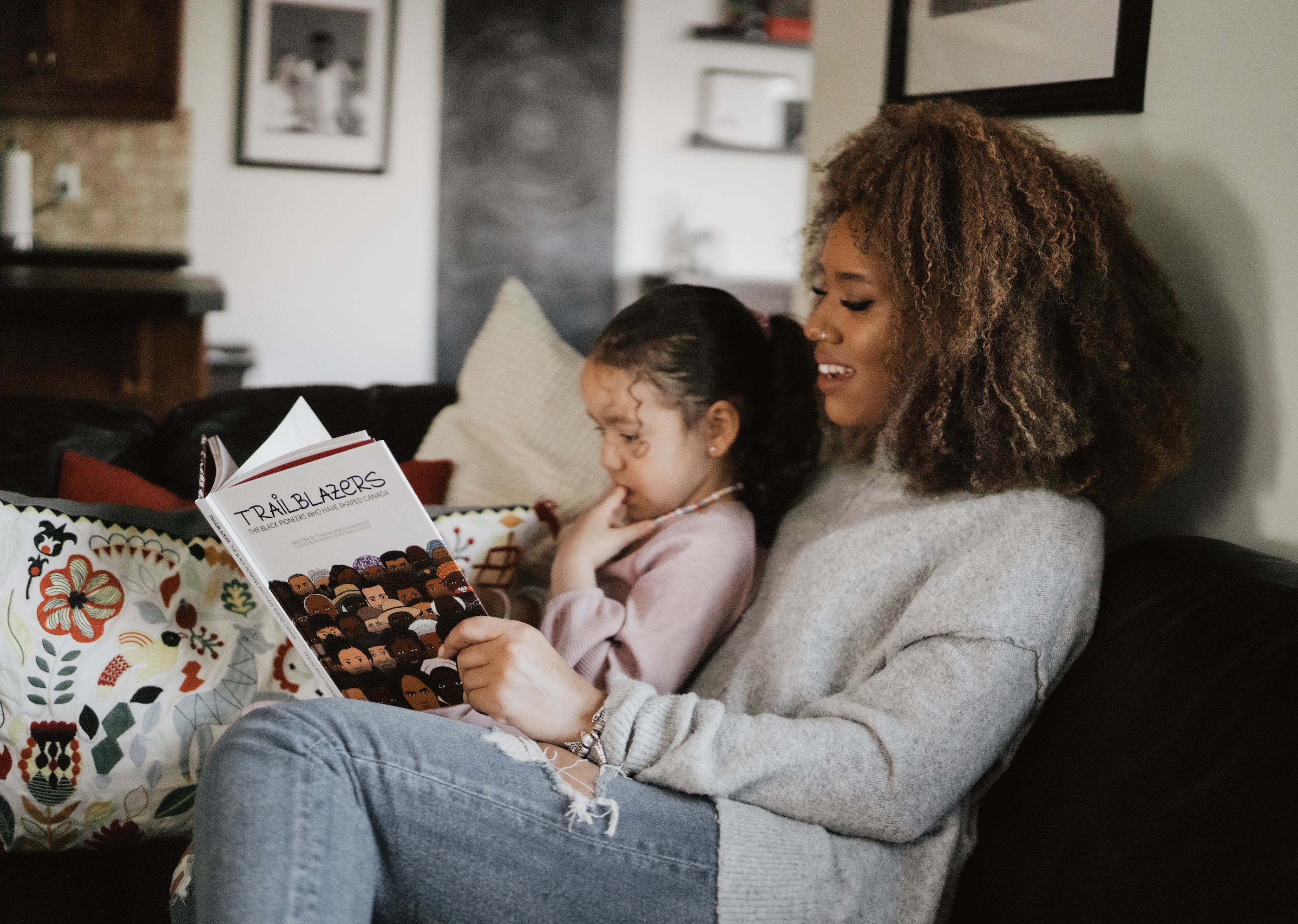 Shared reading time is an essential part of child literacy development, and provides a great opportunity for you to explore history and talk about how it has shaped the realities they know today. Photo by Rose and Range Photography, 2022.