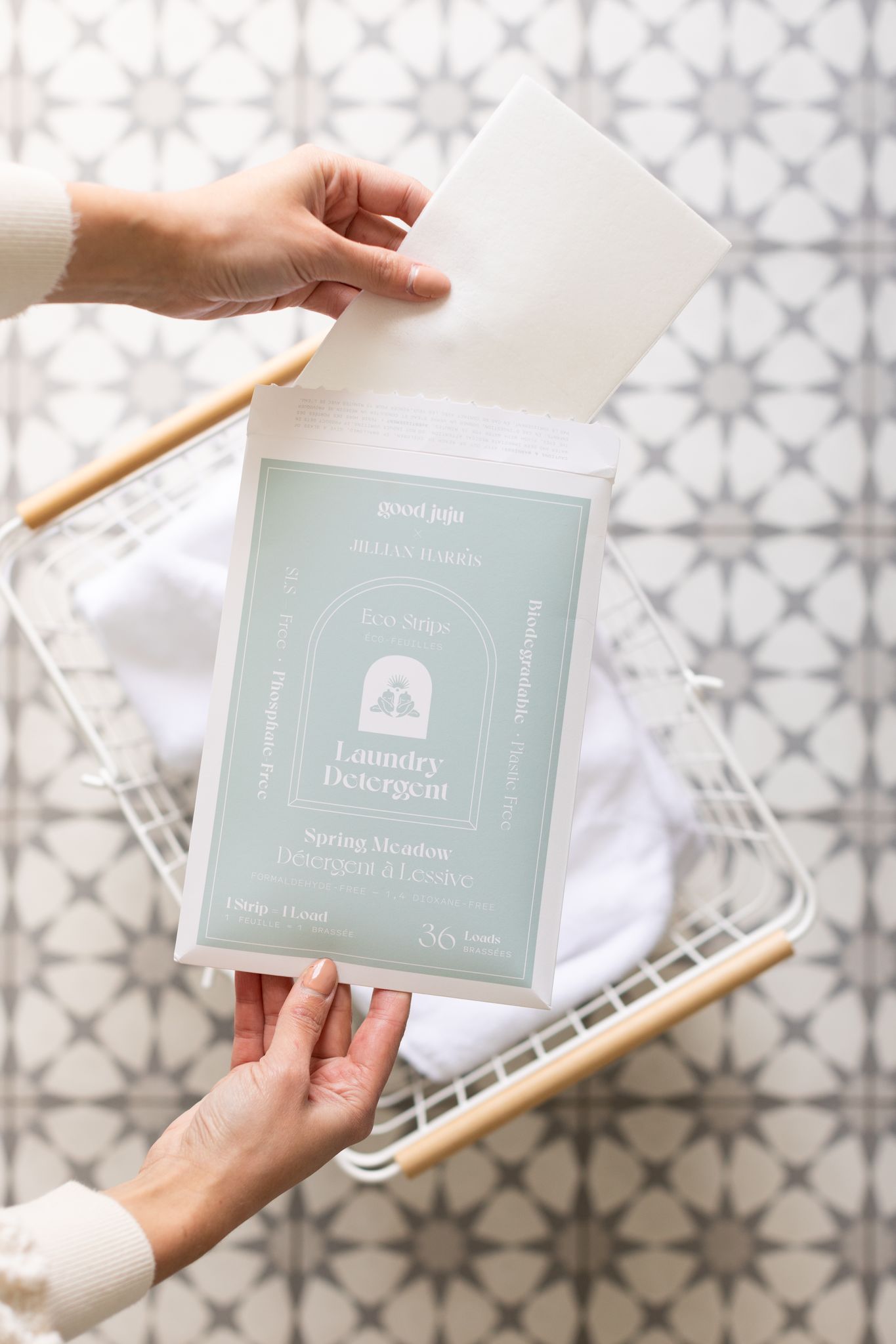 Jillian Harris pulling out a Good Juju Laundry Strips included in the Spring 2022 Jilly Box