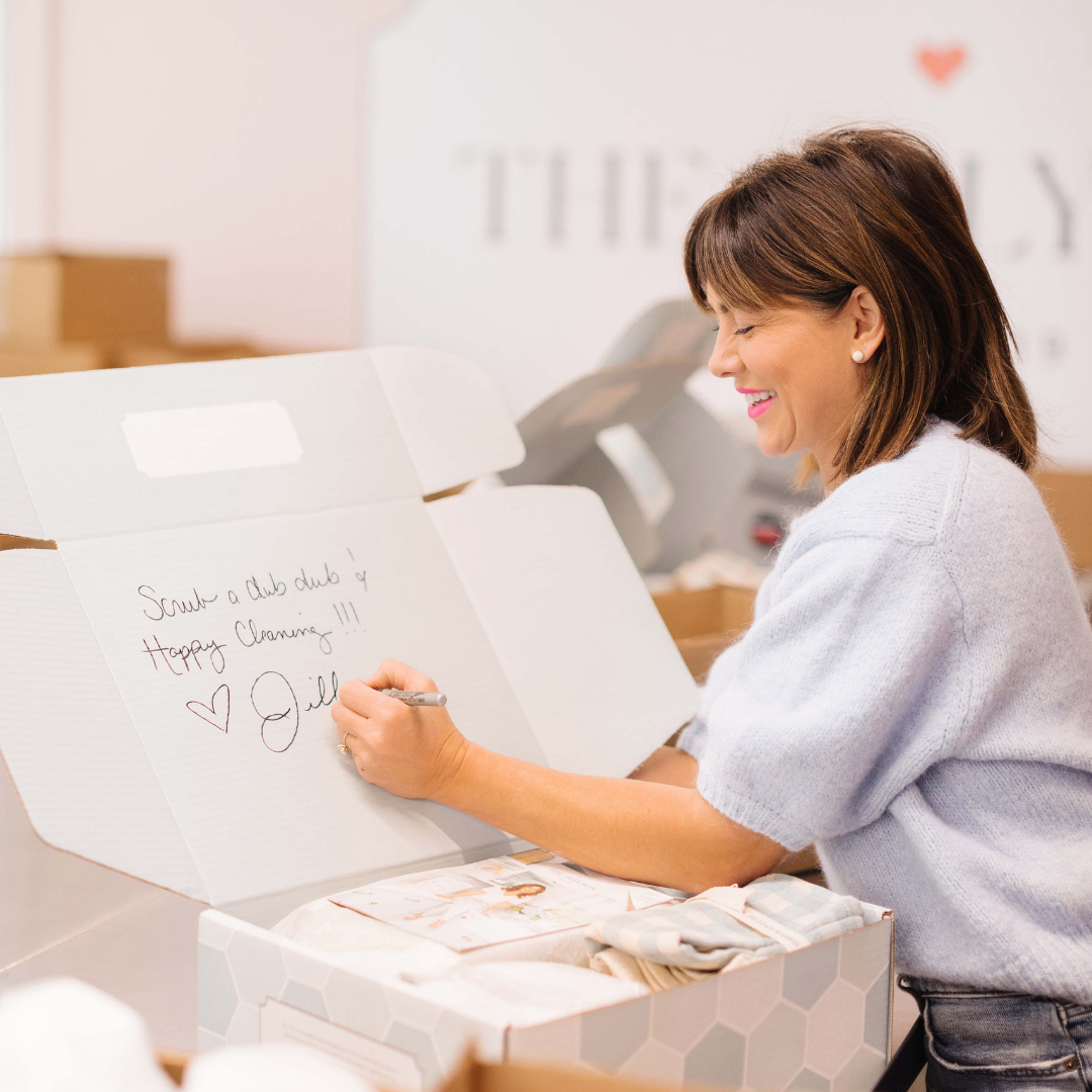 Jillian Harris signing a Spring 2022 Jilly Box.