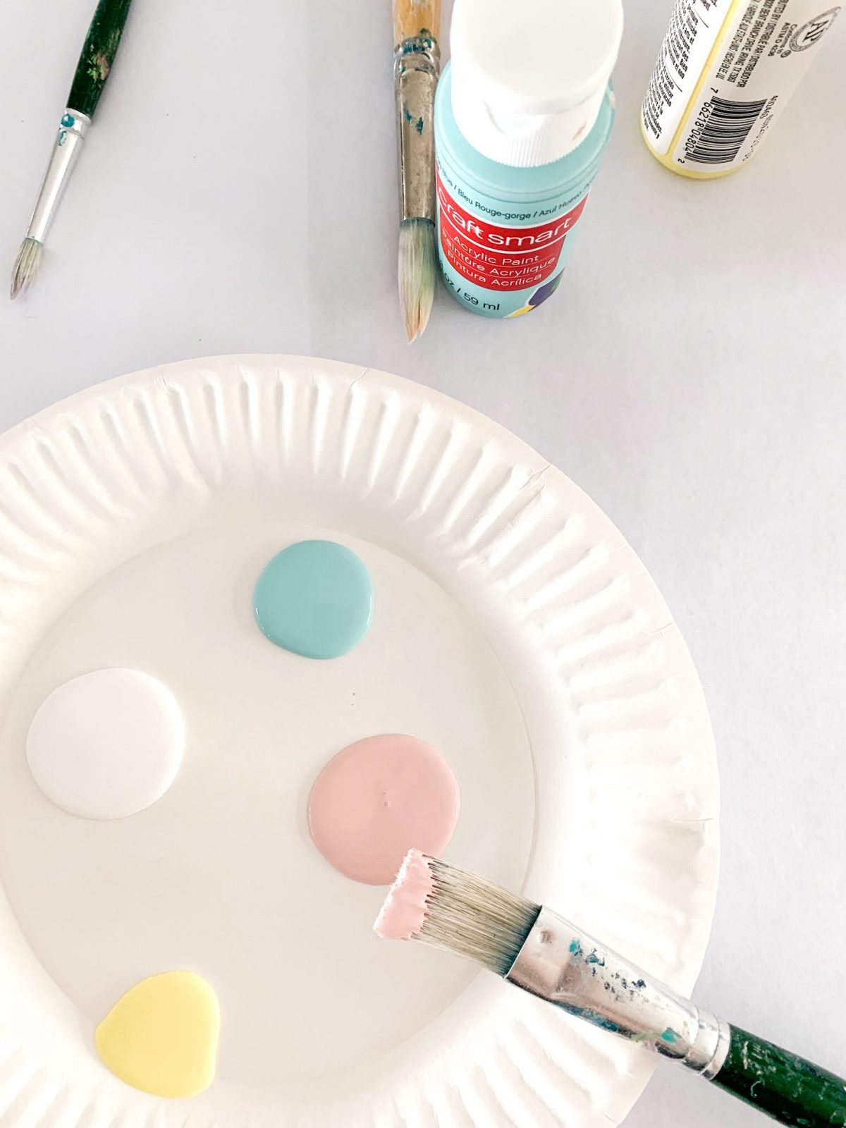 Pastel paints on a plate for easter egg decorating