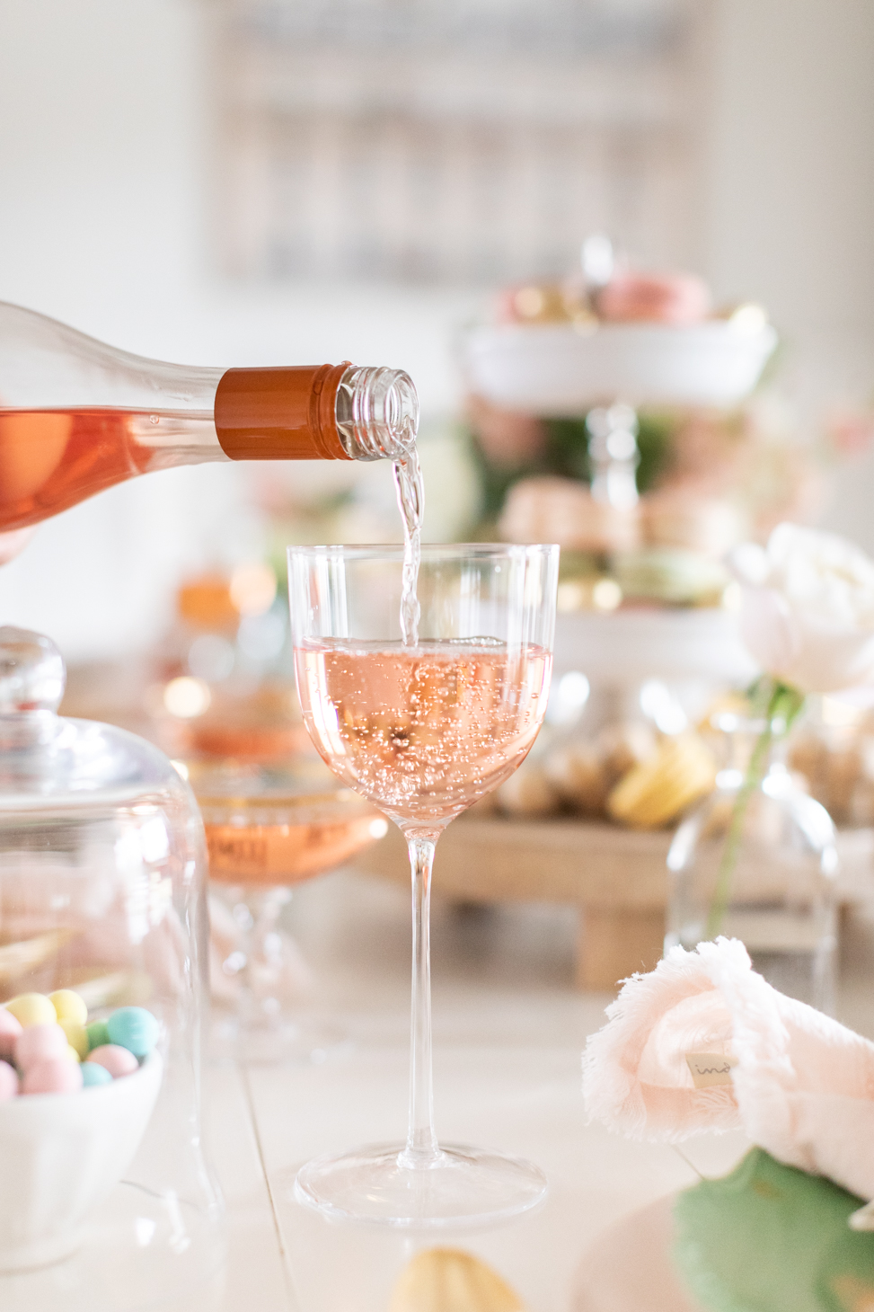 Pouring a glass of Rosé for the Easter Tablescape