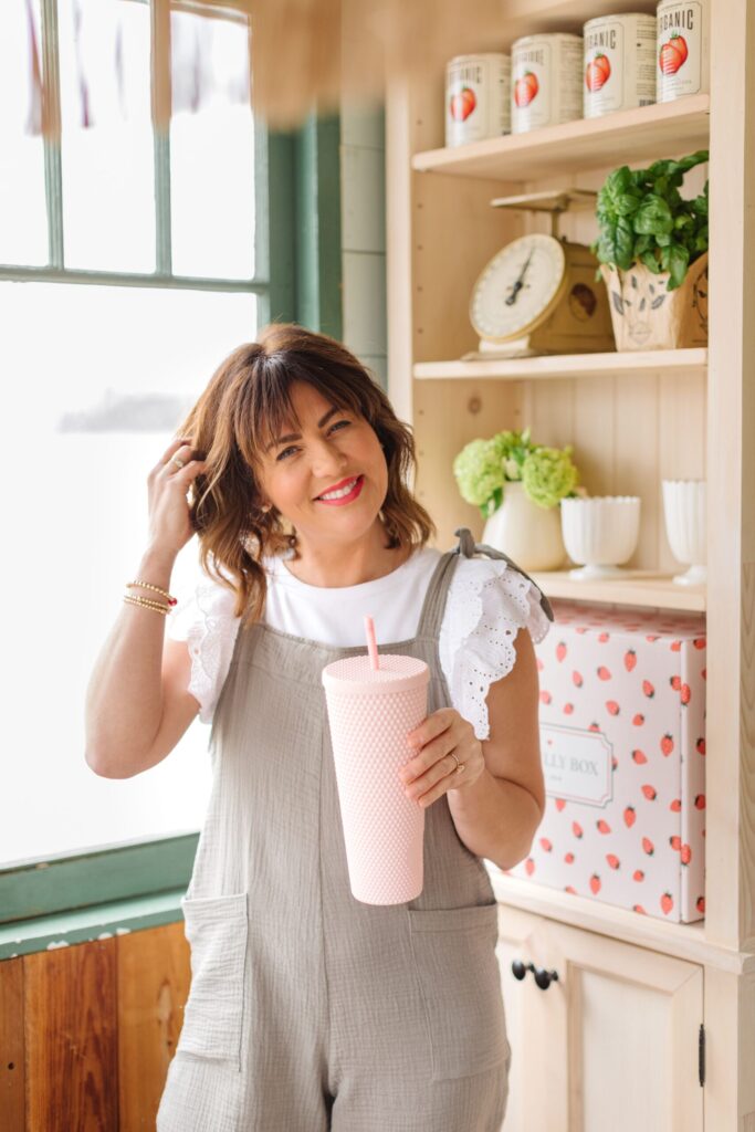 Jillian Harris holding the ASTOR Drinkware Cup