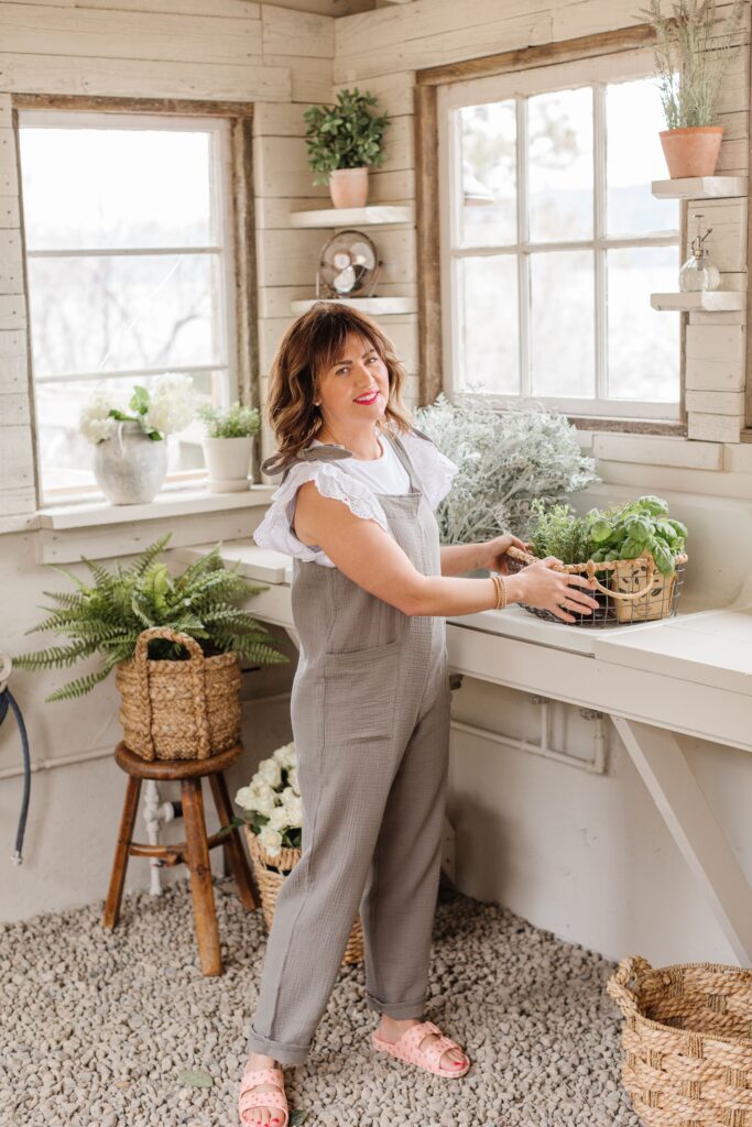 Jillian Harris in her flower shed wearing the Smash and Tess Garden Jillyalls