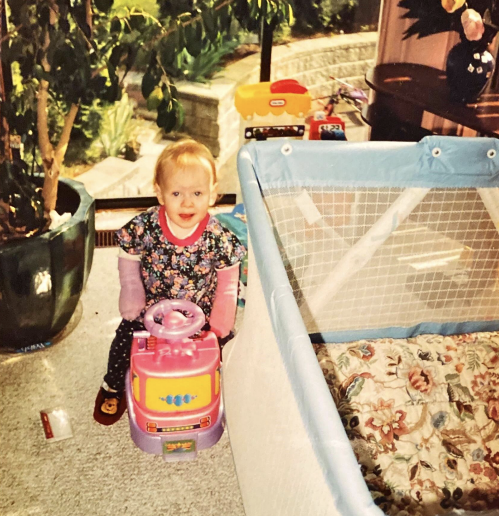 Cheyenne Horvath playing as a child with her casts