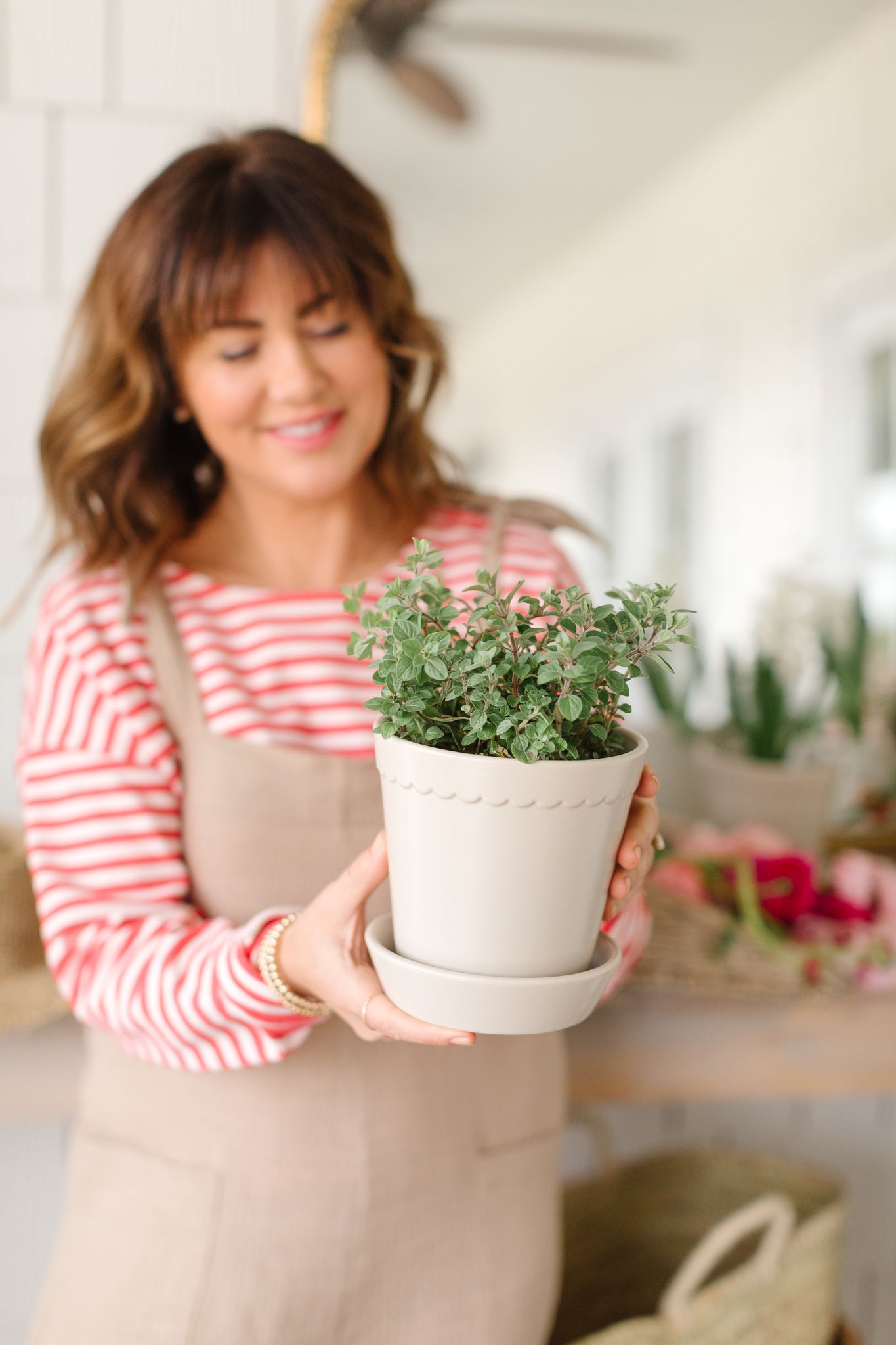 Jillian holding the Hudson and Oak Summer Scallop Planter