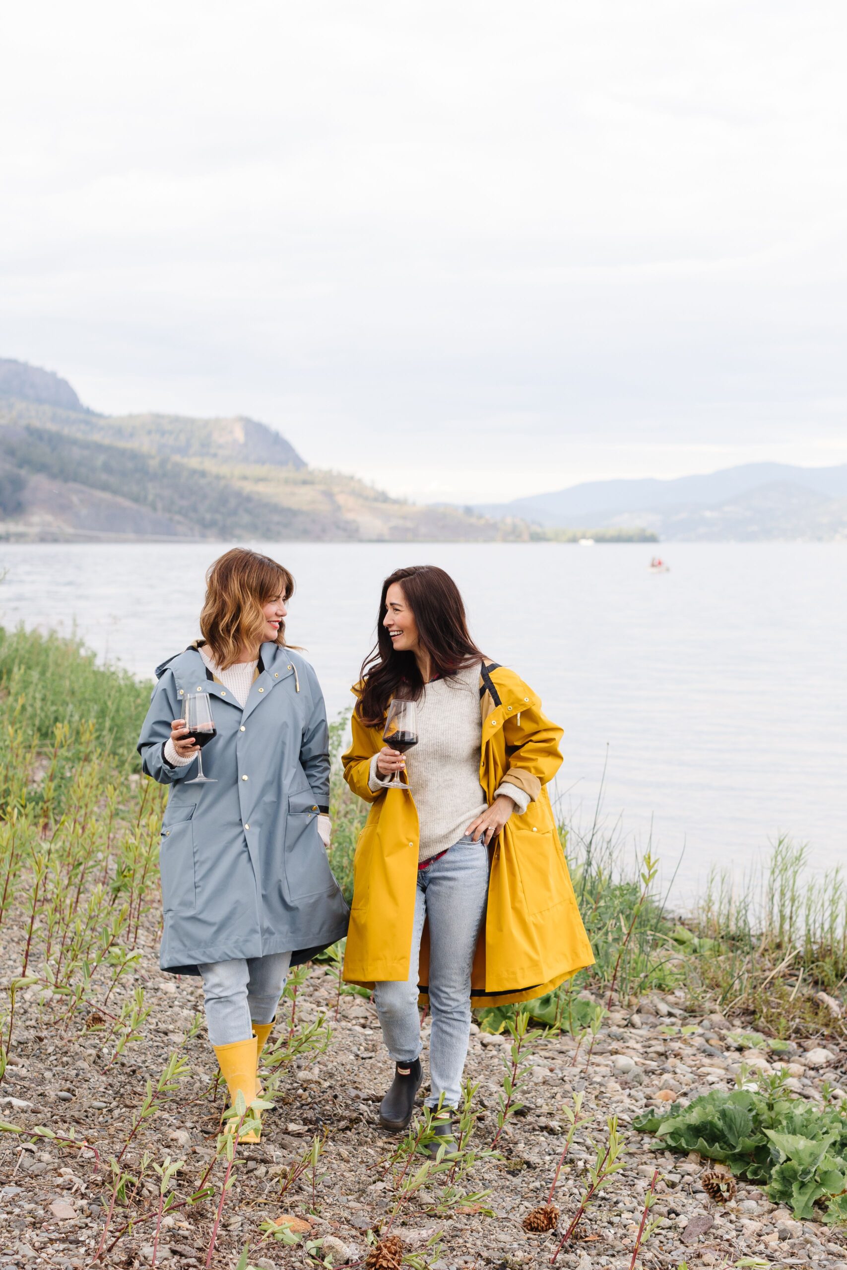 Jillian Harris wearing The Jilly Coat in Heron with and her cousin, Tori Wesszer, who is wearing The Jilly Coat in Duck, both offered as Fall 2022 Jilly Box Add-On options.