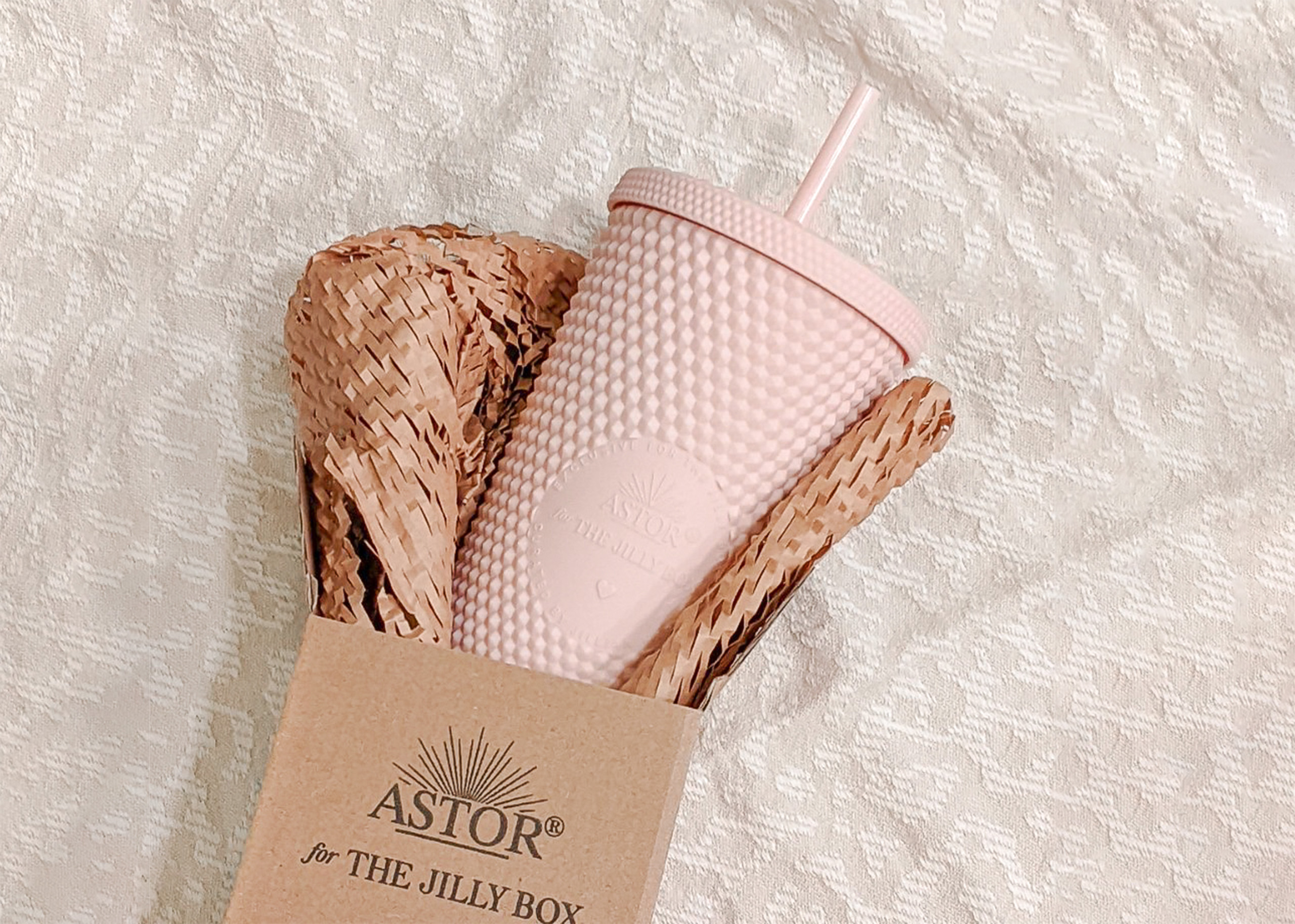 The ASTOR Drinkware Jilly Box Studded Tumbler and it's packaging in honour of Plastic-Free July.