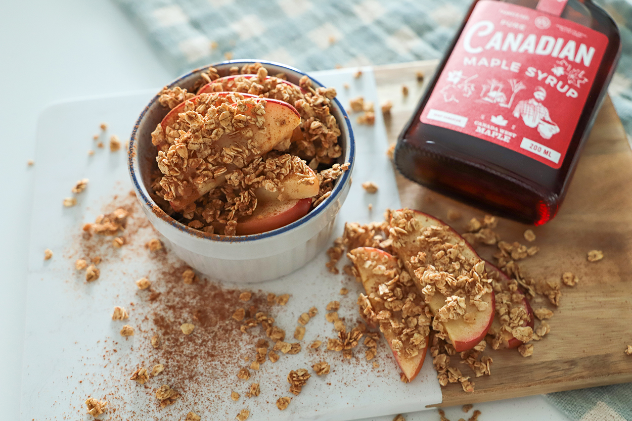 An overview of apple crisp bites as part of the brain food recipes with a bottle of maple syrup. 