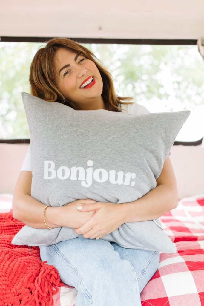 Jillian Harris with the Province of Canada Bonjour Cushion Cover from The Fall 2022 Jilly Box