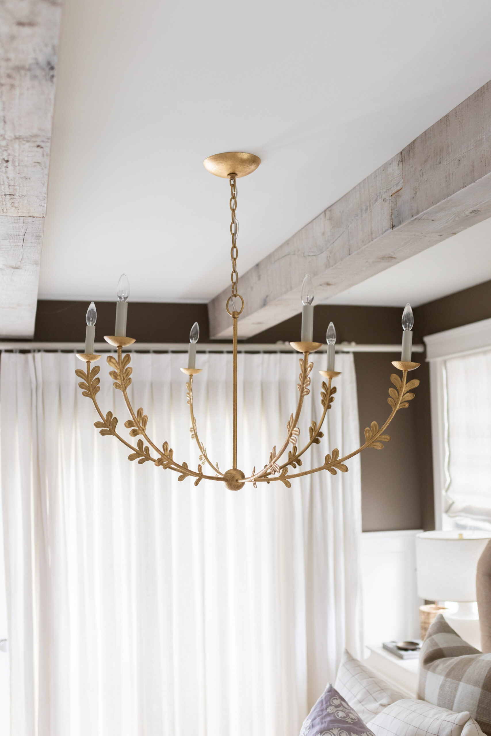 Chandelier for Jillian Harris's brown bedroom transformation with The Cross