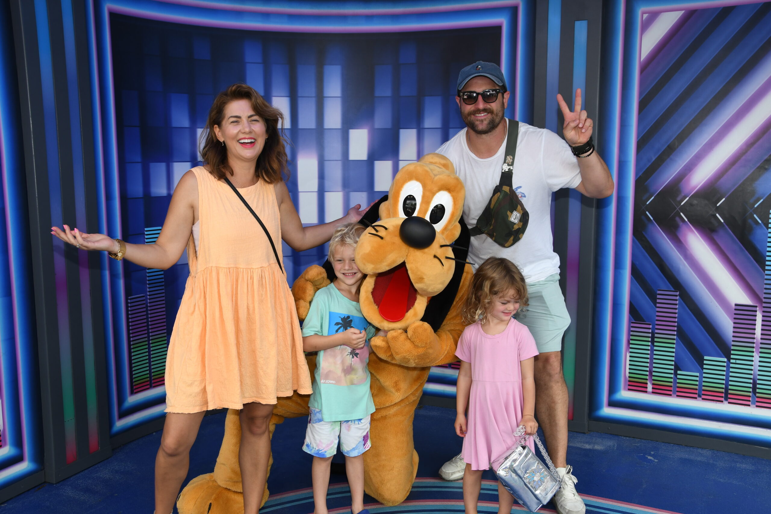 Jillian Harris, Justin and their kids at Walt Disney World, posing with Pluto