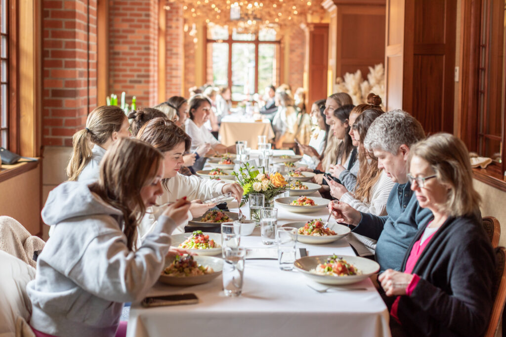 Jillian Harris and Team Jilly eating dinner at The Oak Bay Beach Hotel for The Oak Bay Beach Hotel Wellness Retreat