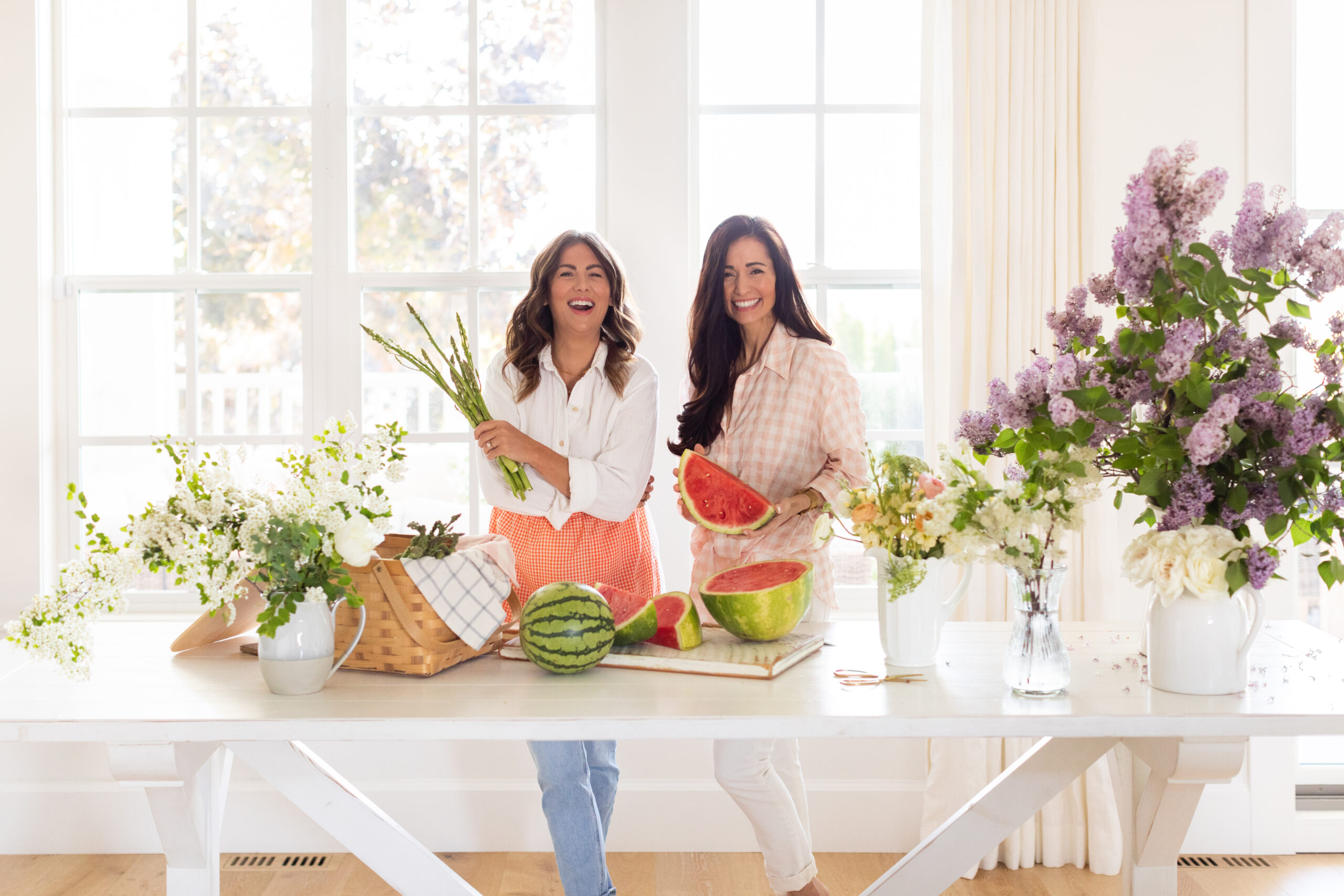 Jilly and Tori cooking and enjoying wine for Fraiche Food, Fuller Hearts cookbook