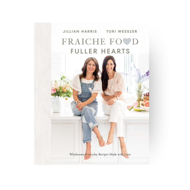 Fraiche Food, Fuller Hearts book cover showing Jillian Harris and Tori Wesszer sitting a bright white kitchen with flowers and fruit on the counter