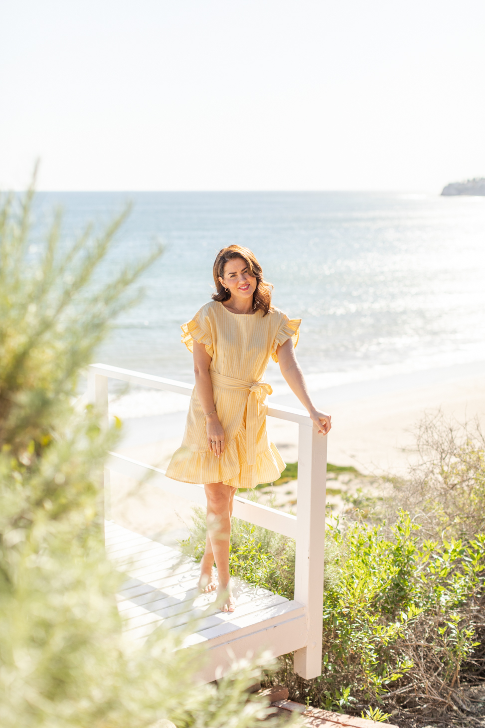 Jillian Harris wearing a yellow dress for her 2023 Joe Fresh Summer Collection