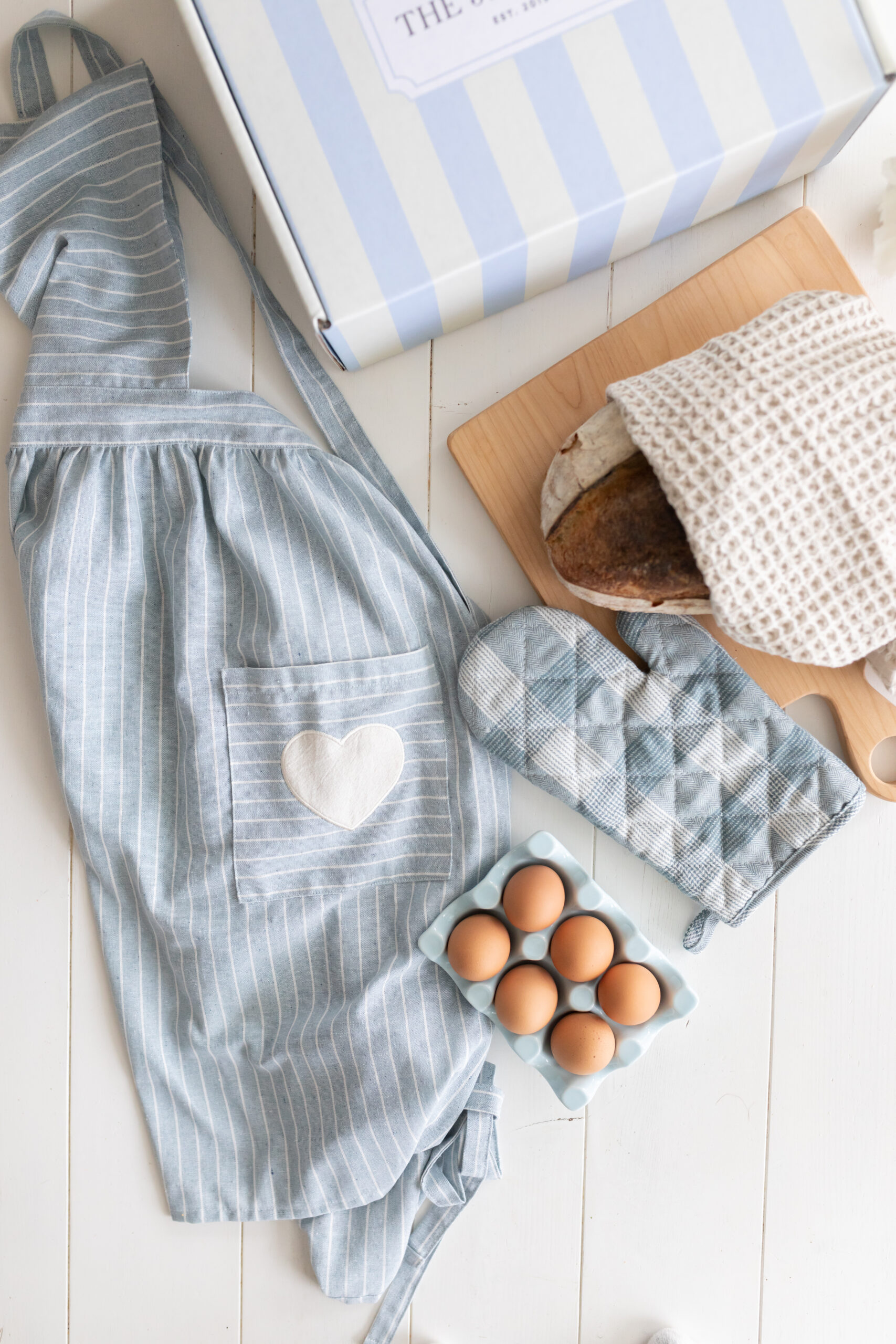 The cross marjorie blue and white apron with matching oven mitts and the fraiche food, fuller hearts collection box