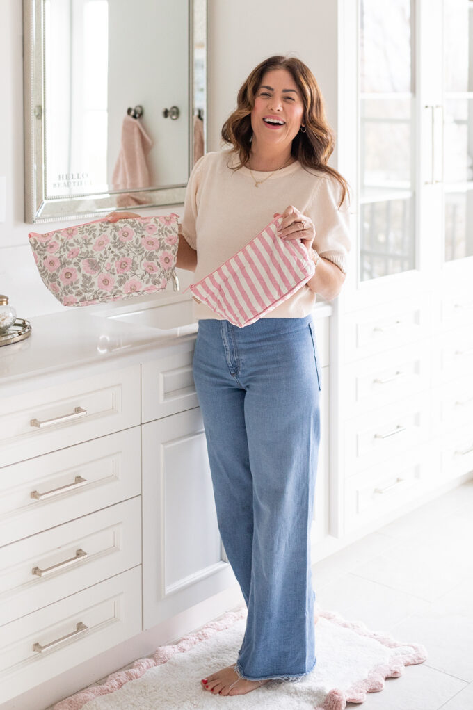 Jillian Harris holding the Ela Handbags Cosmetic Cases