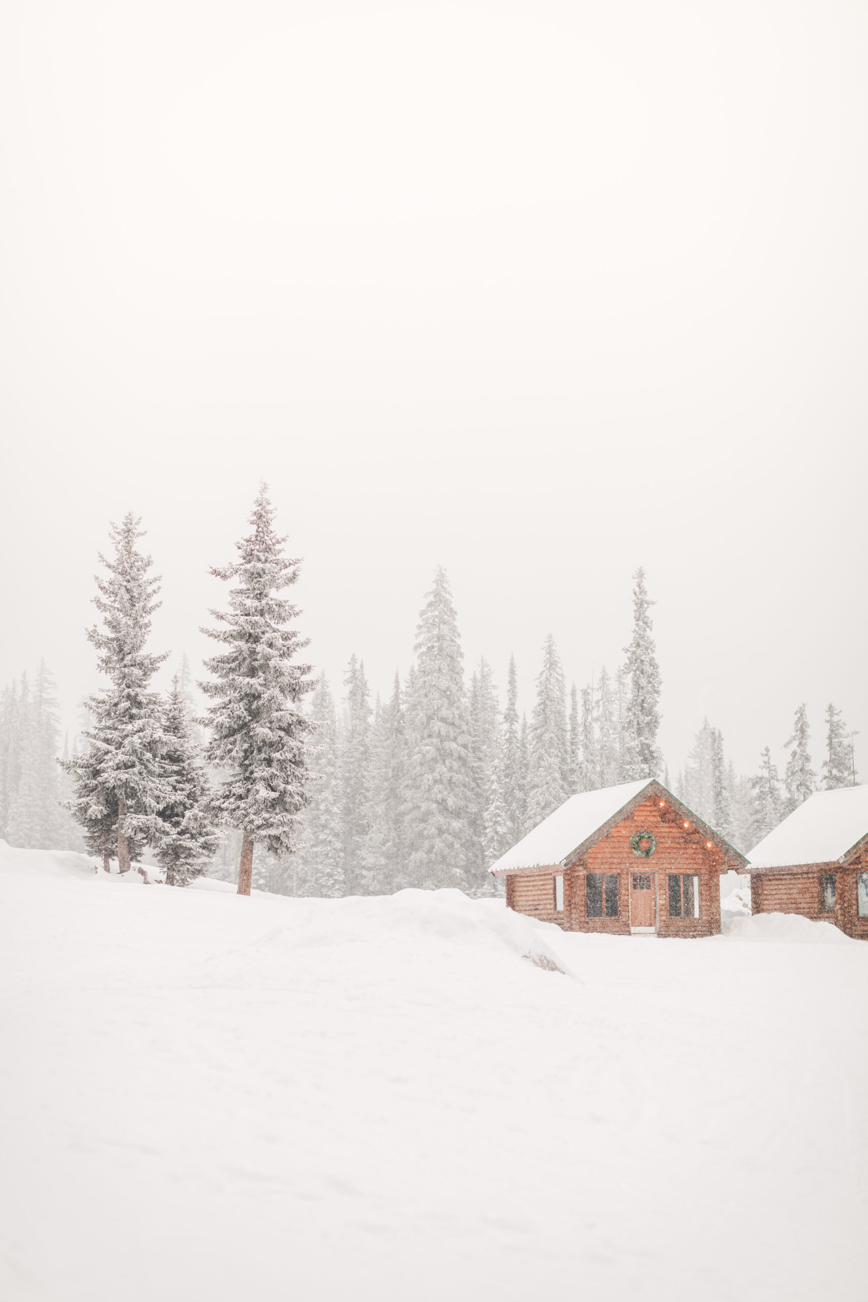 Cabin in winter surrounded by snow