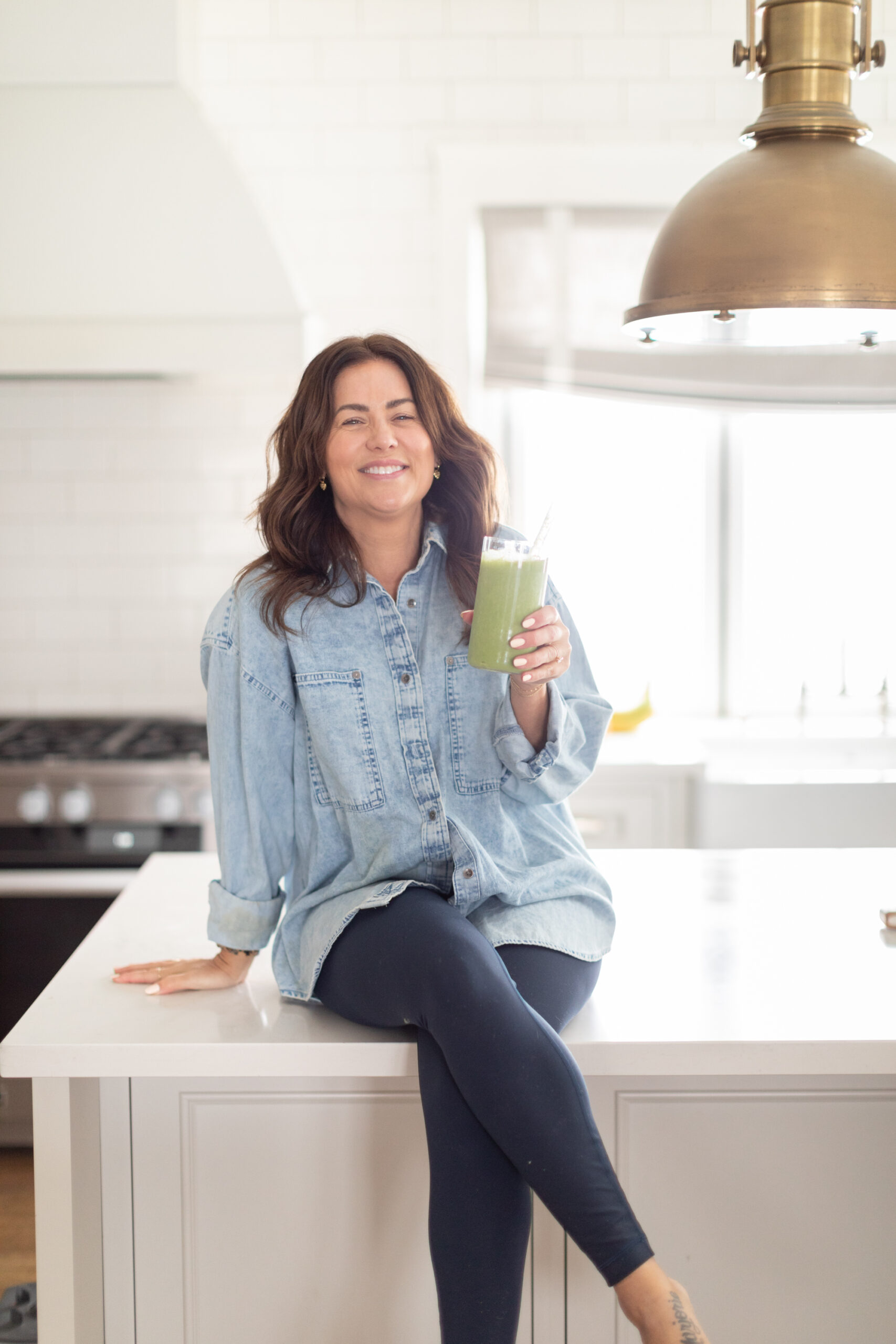 Jillian Harris in her kitchen with her new revamped green smoothie