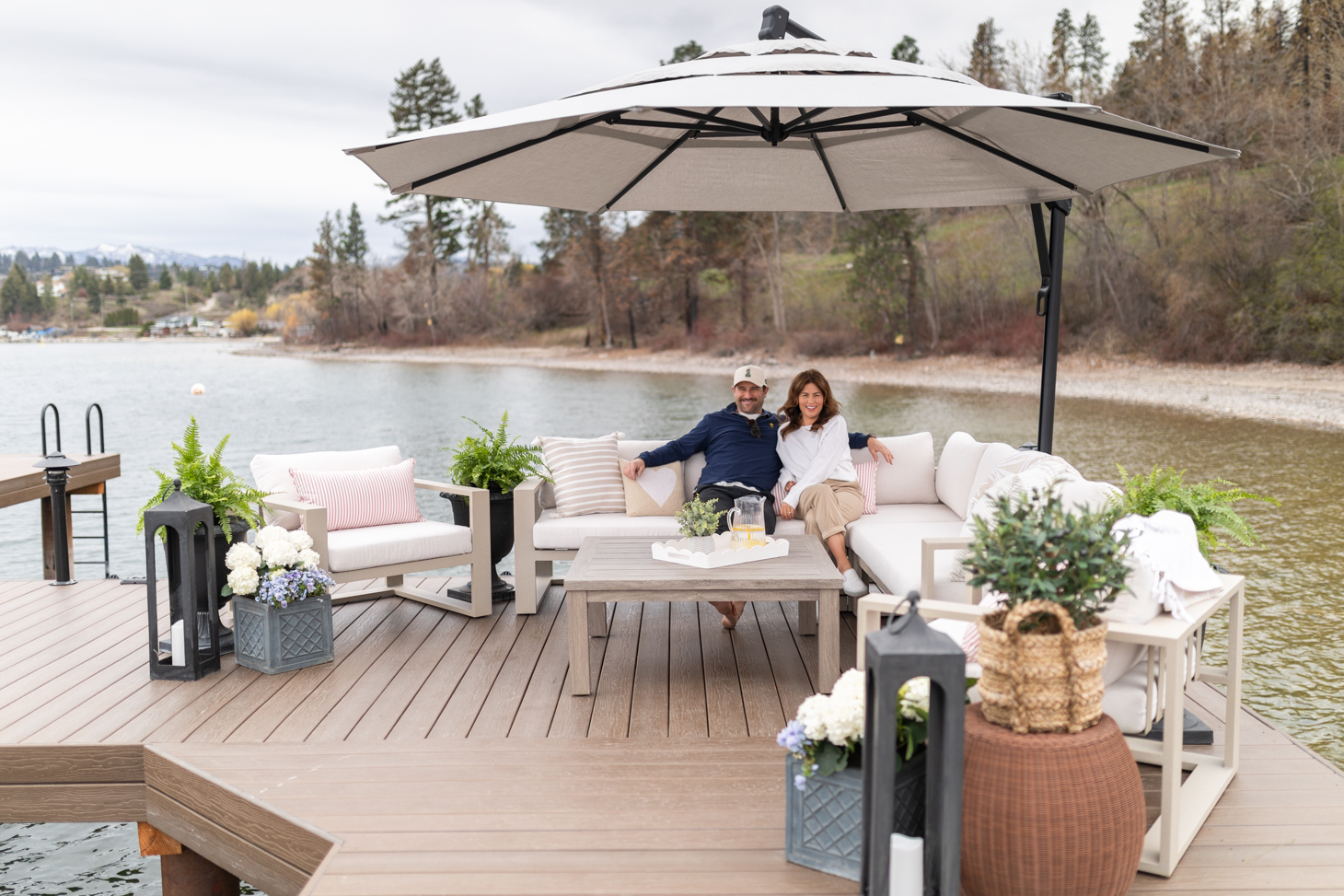 Jillian and Justin sitting on the Hauser couch on the dock