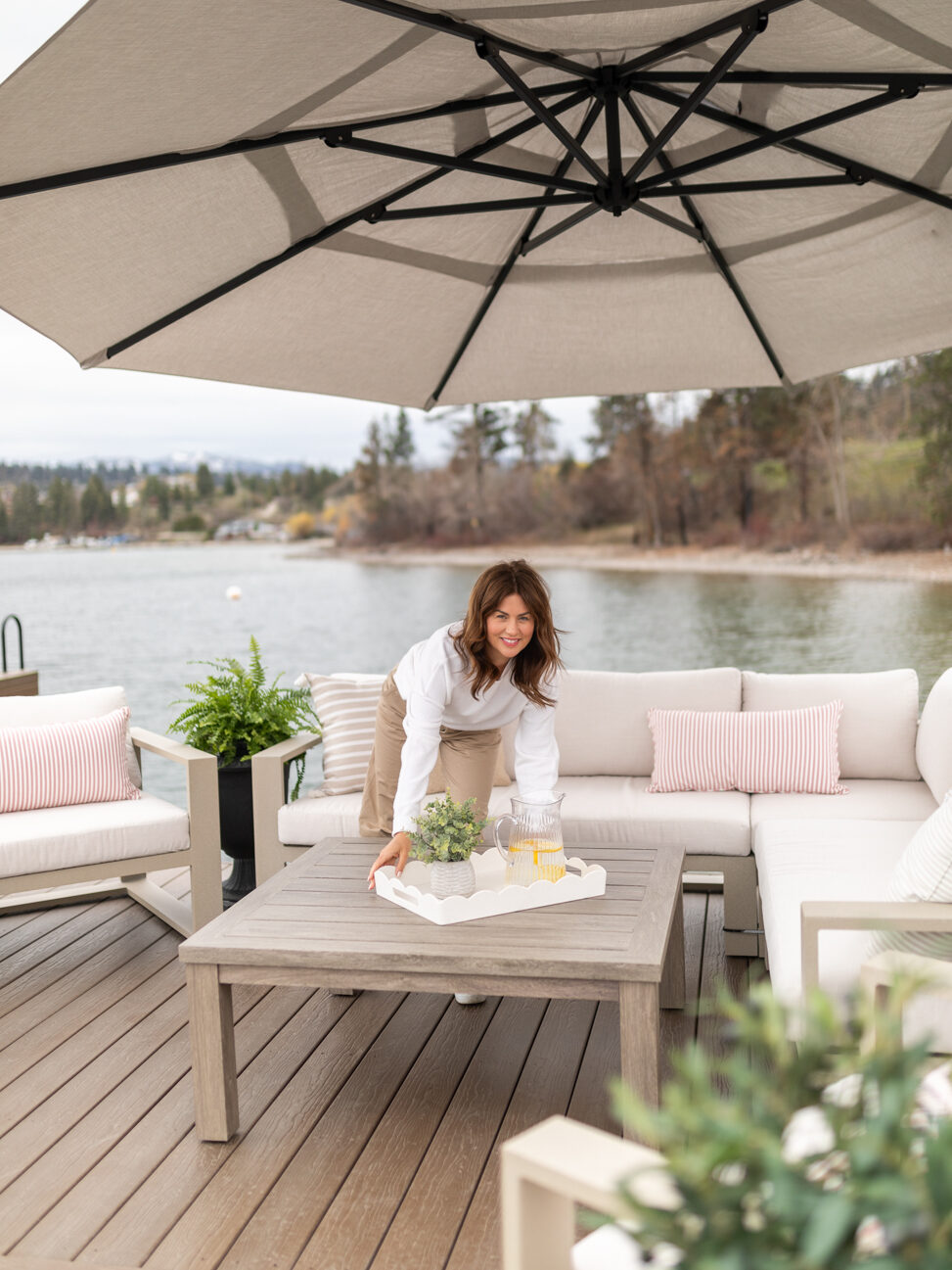 Jillian placing a tray on the Hauser coffee table