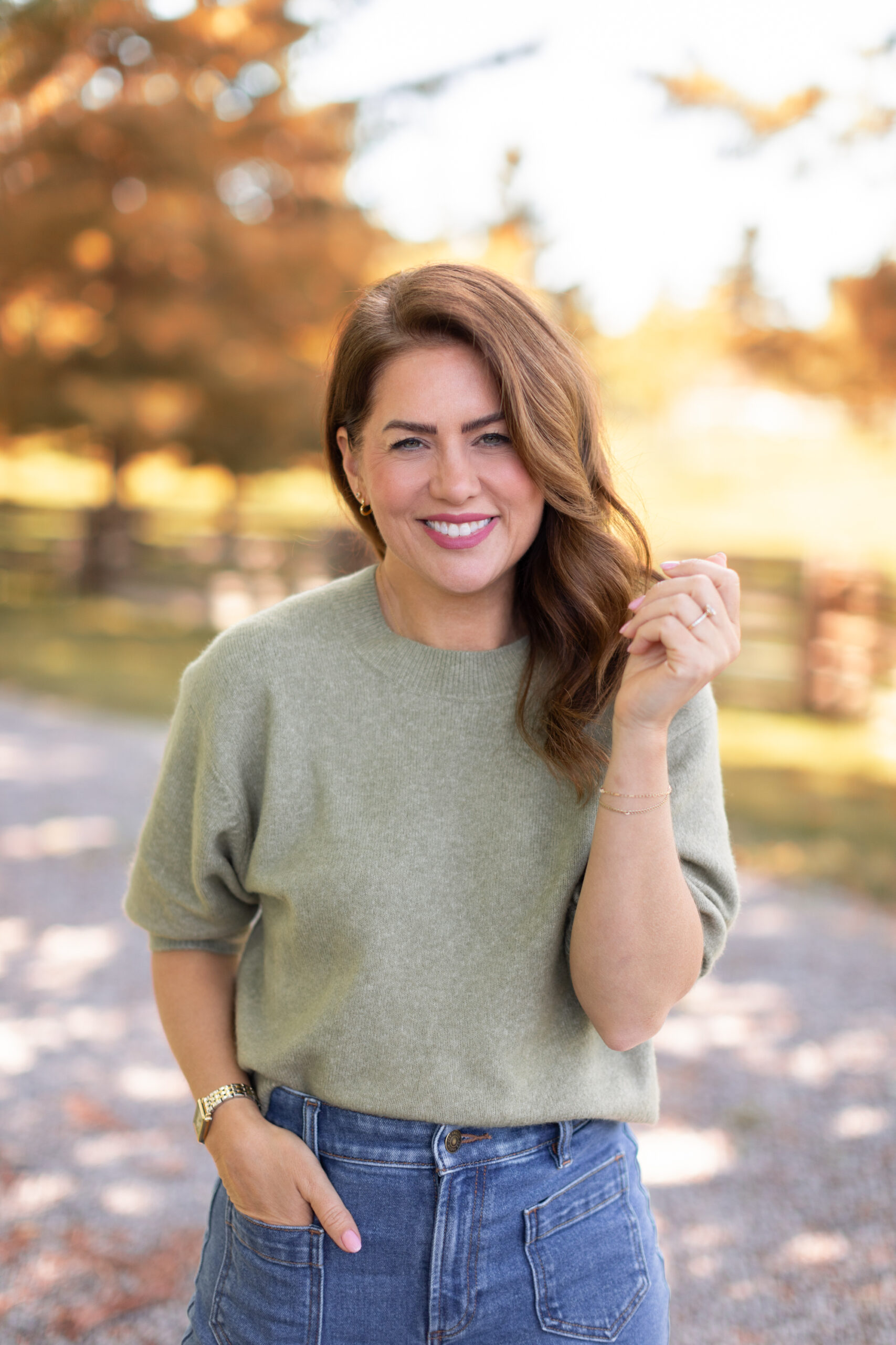 Jillian Harris wearing a green short sleeve sweater from her 2024 Joe Fresh Fall Collection