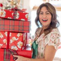 Jillian Harris holding a Christmas gifts