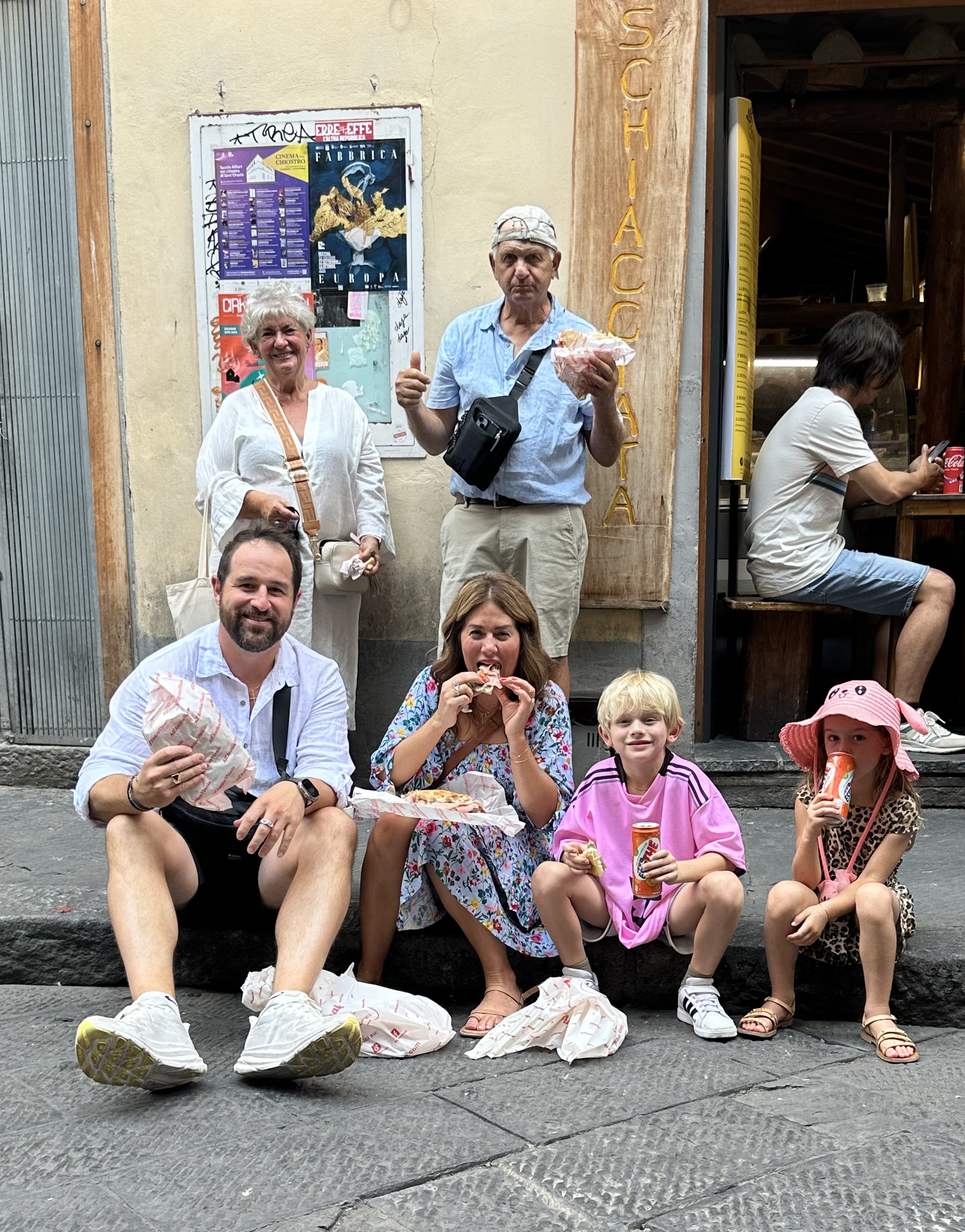 Jillian Harris and family enjoying sandwiches at Al Antico Vinaio in Florence, Italy