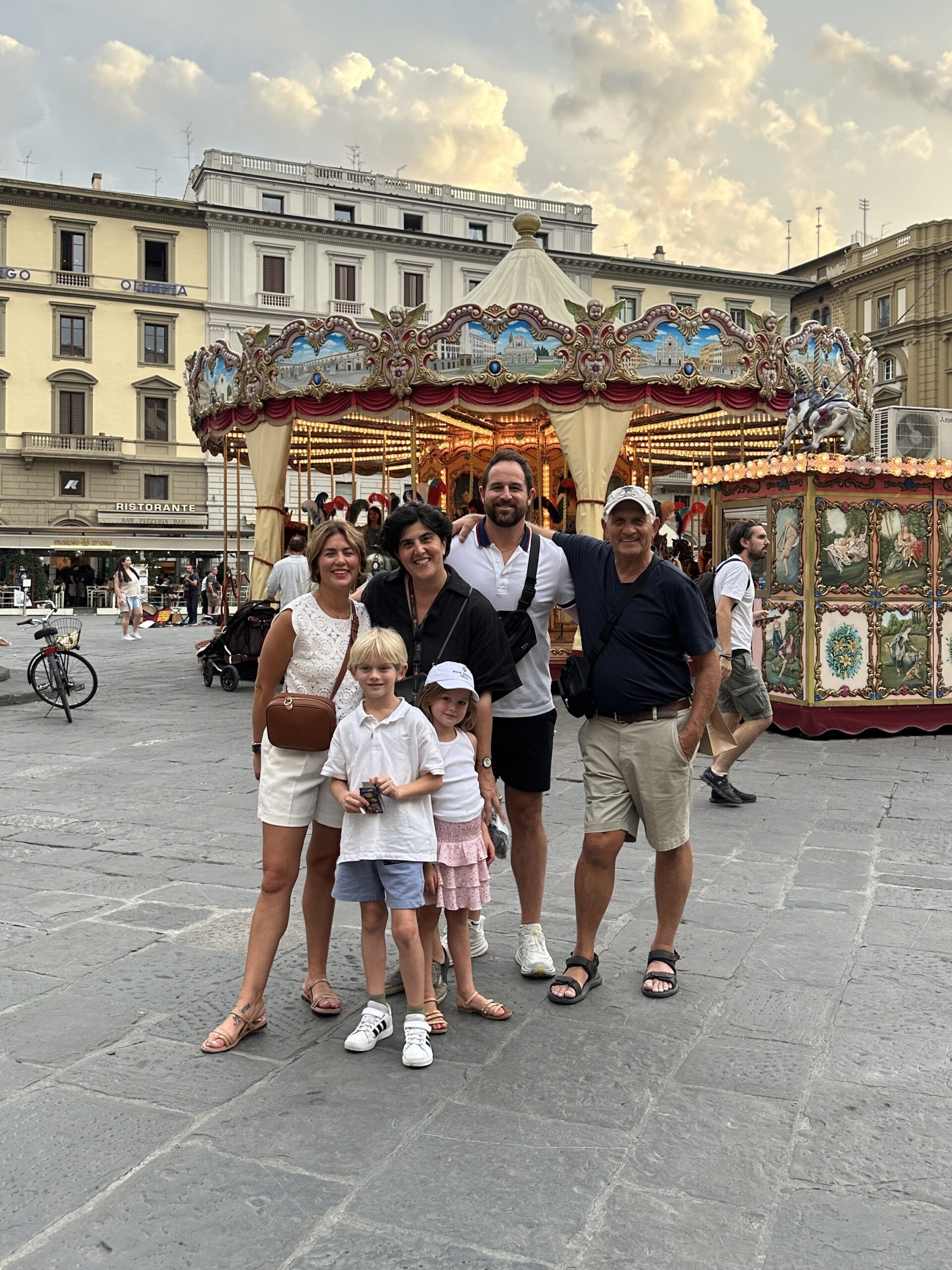 Jillian and family in front of a carousel in Florence, Italy!
