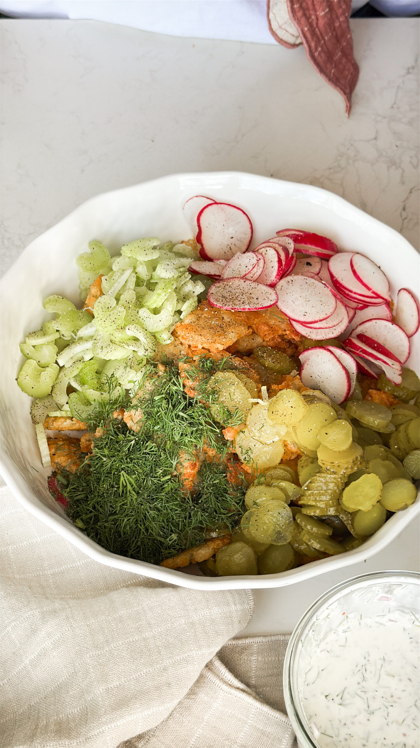 Assembling the tater tot potato salad