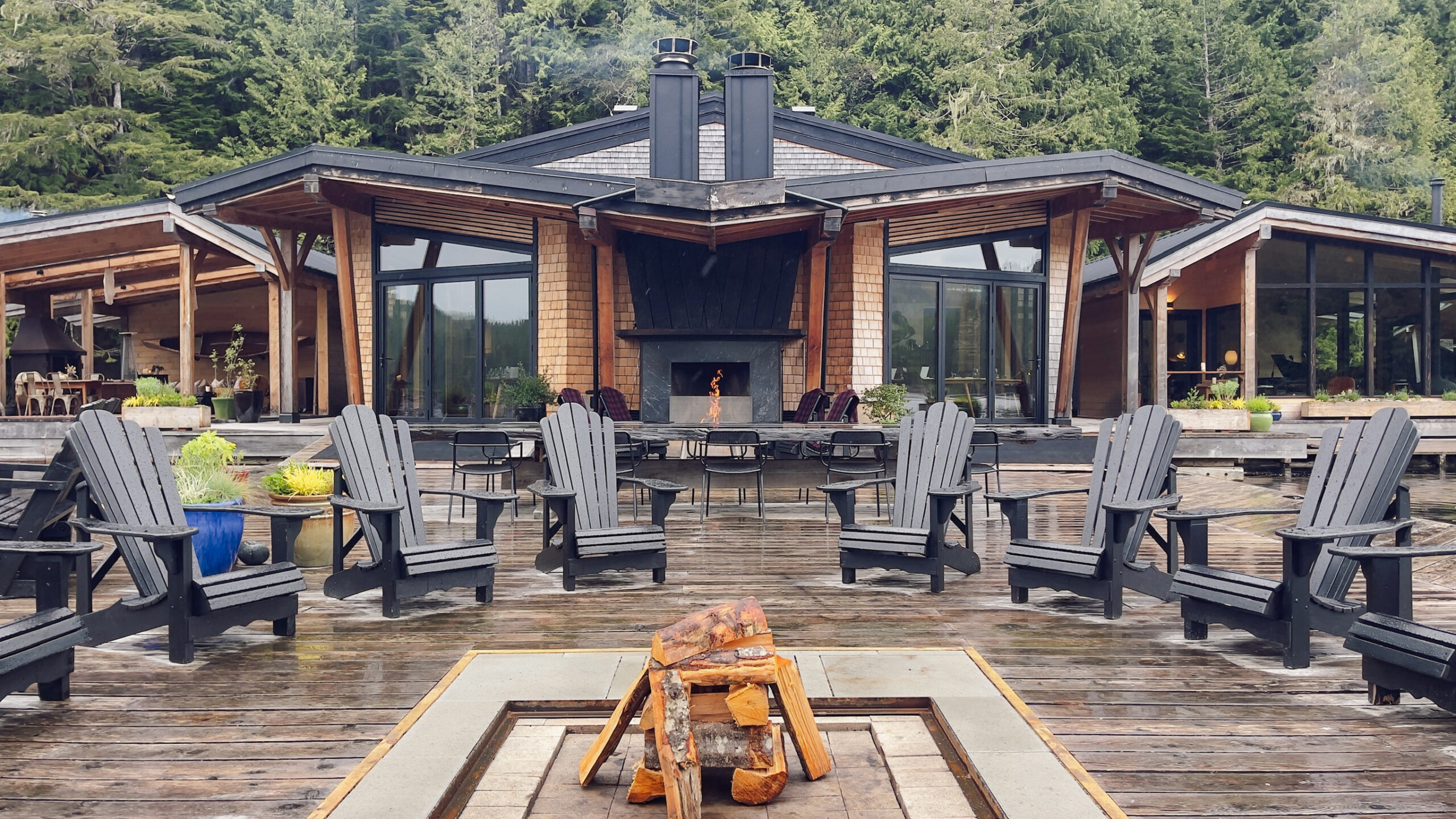Fire pit and Adirondack chairs at Nimmo Bay Resort