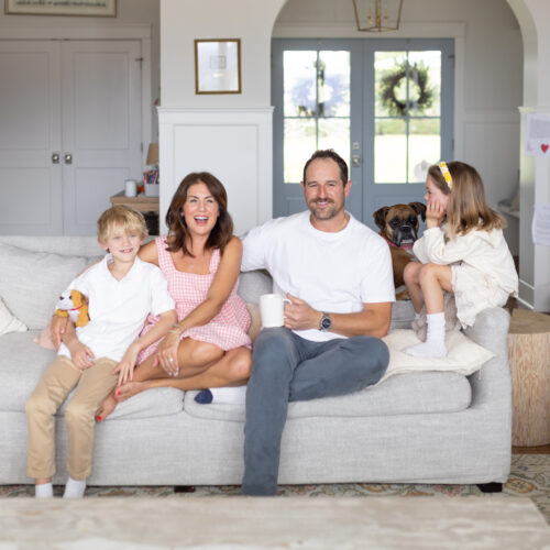 Jillian Harris and Justin Pasutto sitting on the couch with their kids